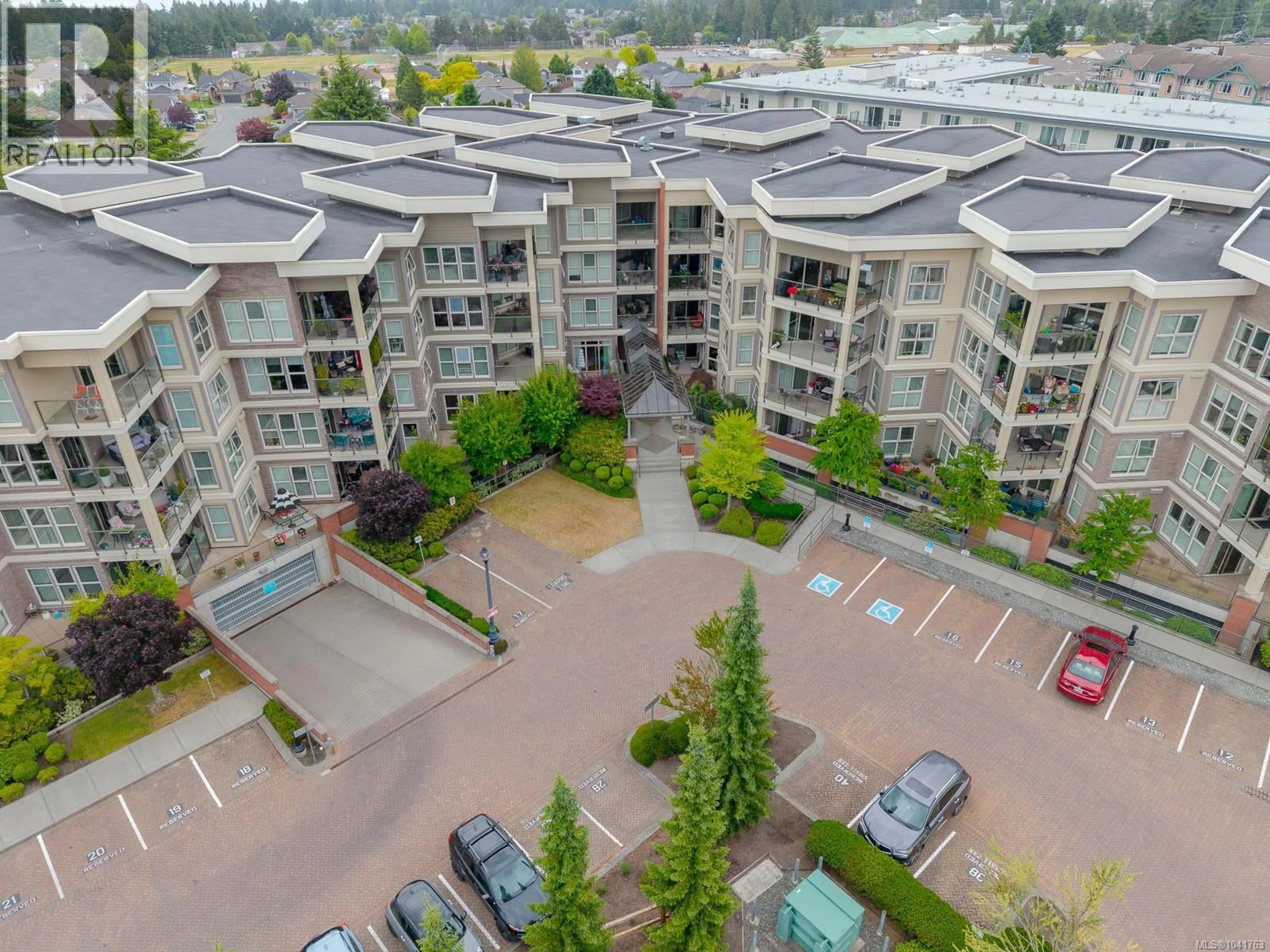 A pic from outside/outdoor area/front of a property/back of a property/a pic from drone, city buildings view from balcony for 416 - 6310 MCROBB AVENUE, Nanaimo British Columbia V9V1W8