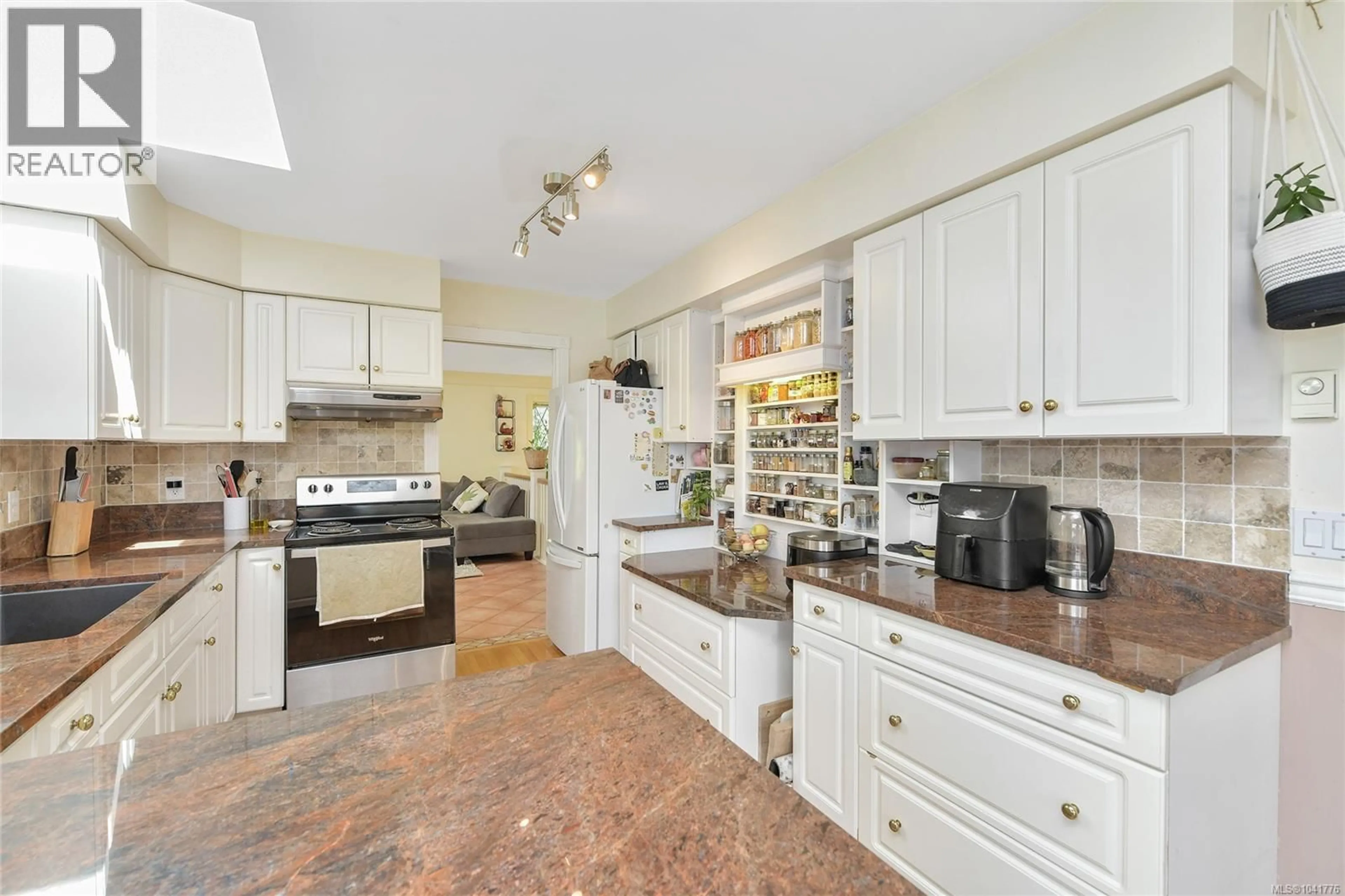 Standard kitchen, ceramic/tile floor for 4296 QUADRA STREET, Saanich British Columbia V8X1L6