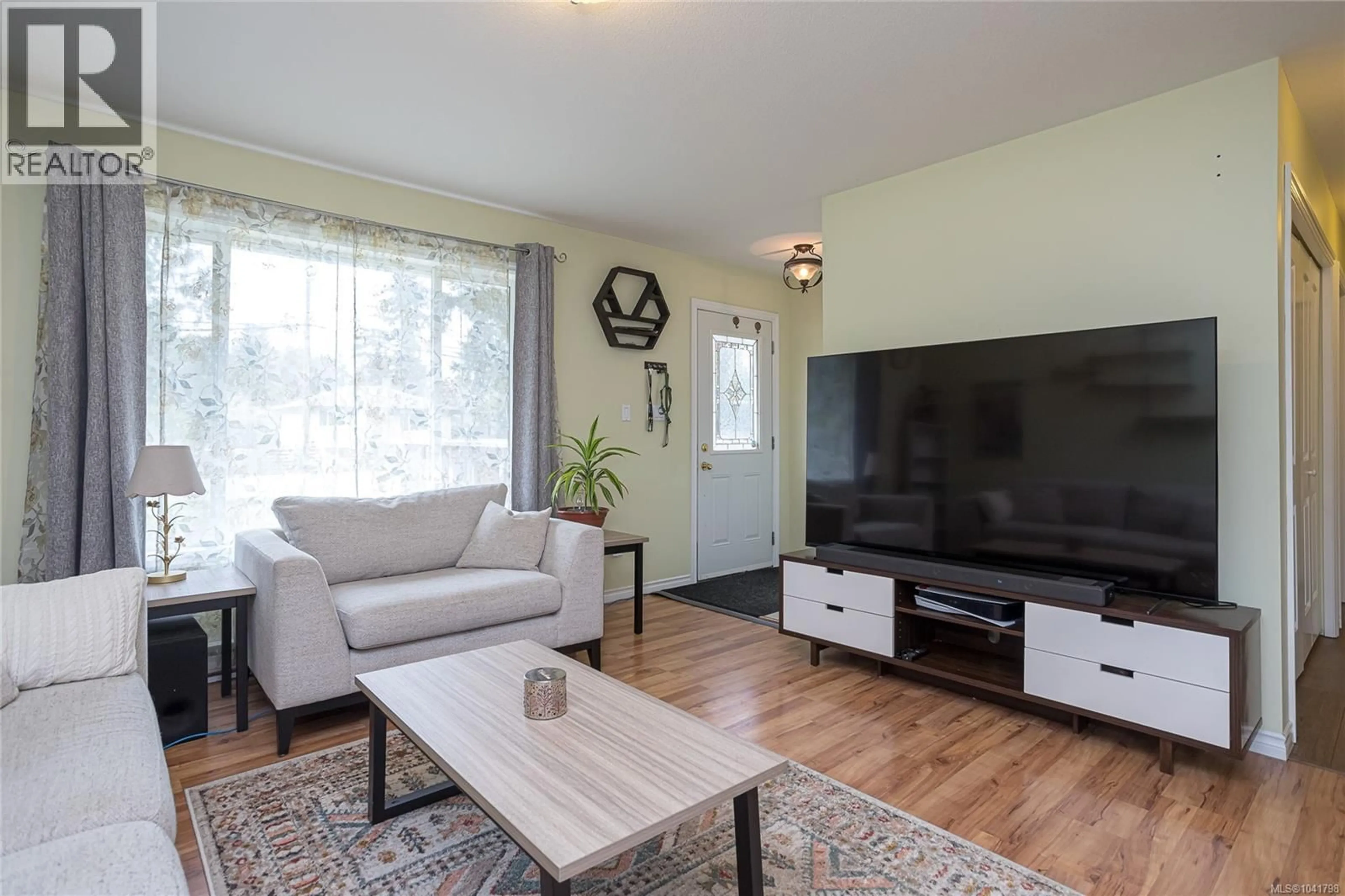 Living room with furniture, wood/laminate floor for 2168 YELLOW POINT ROAD, Nanaimo British Columbia V9X1W6