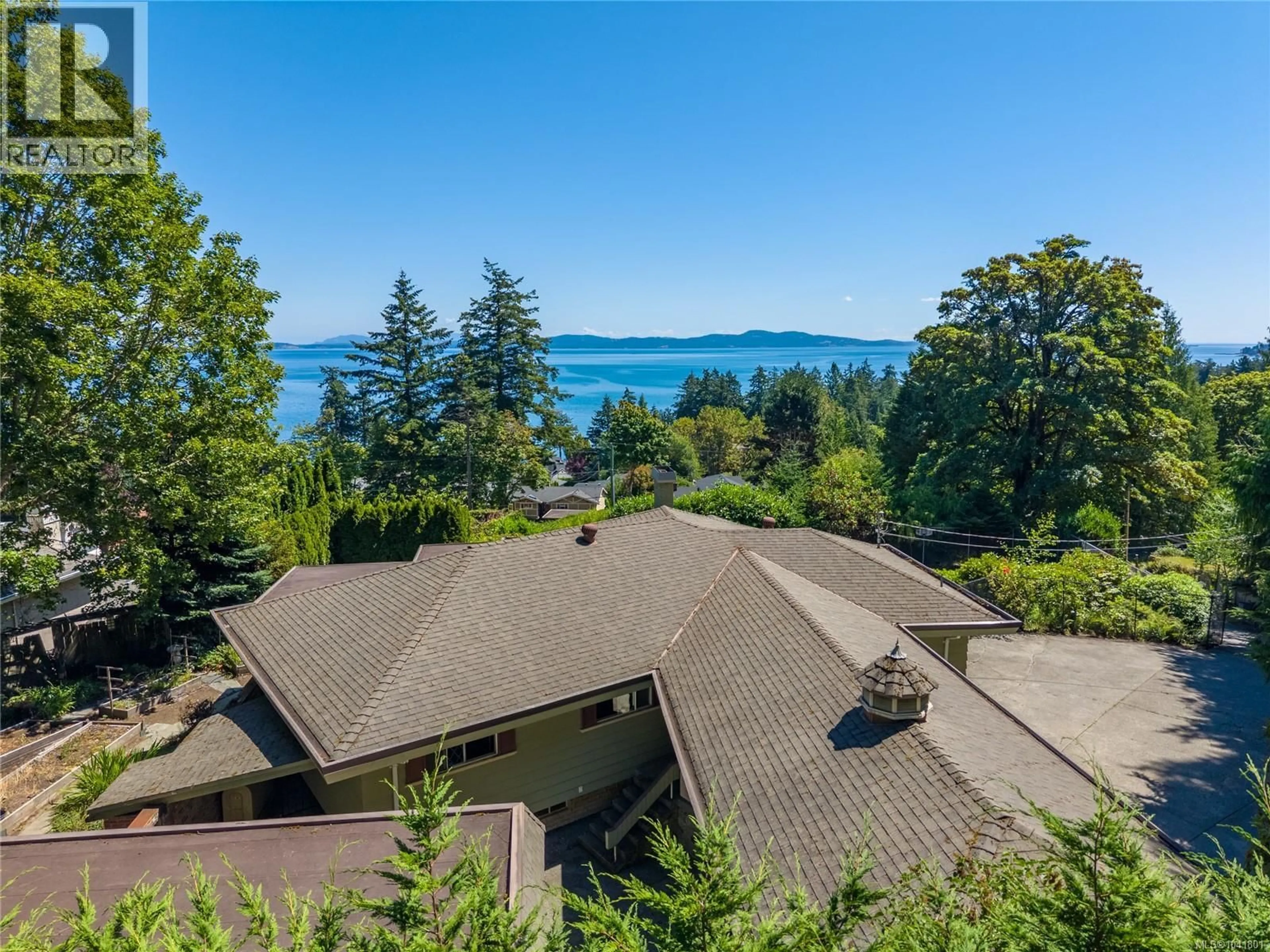 A pic from outside/outdoor area/front of a property/back of a property/a pic from drone, water/lake/river/ocean view for 4916 LOCHSIDE DRIVE, Saanich British Columbia V8Y2E4