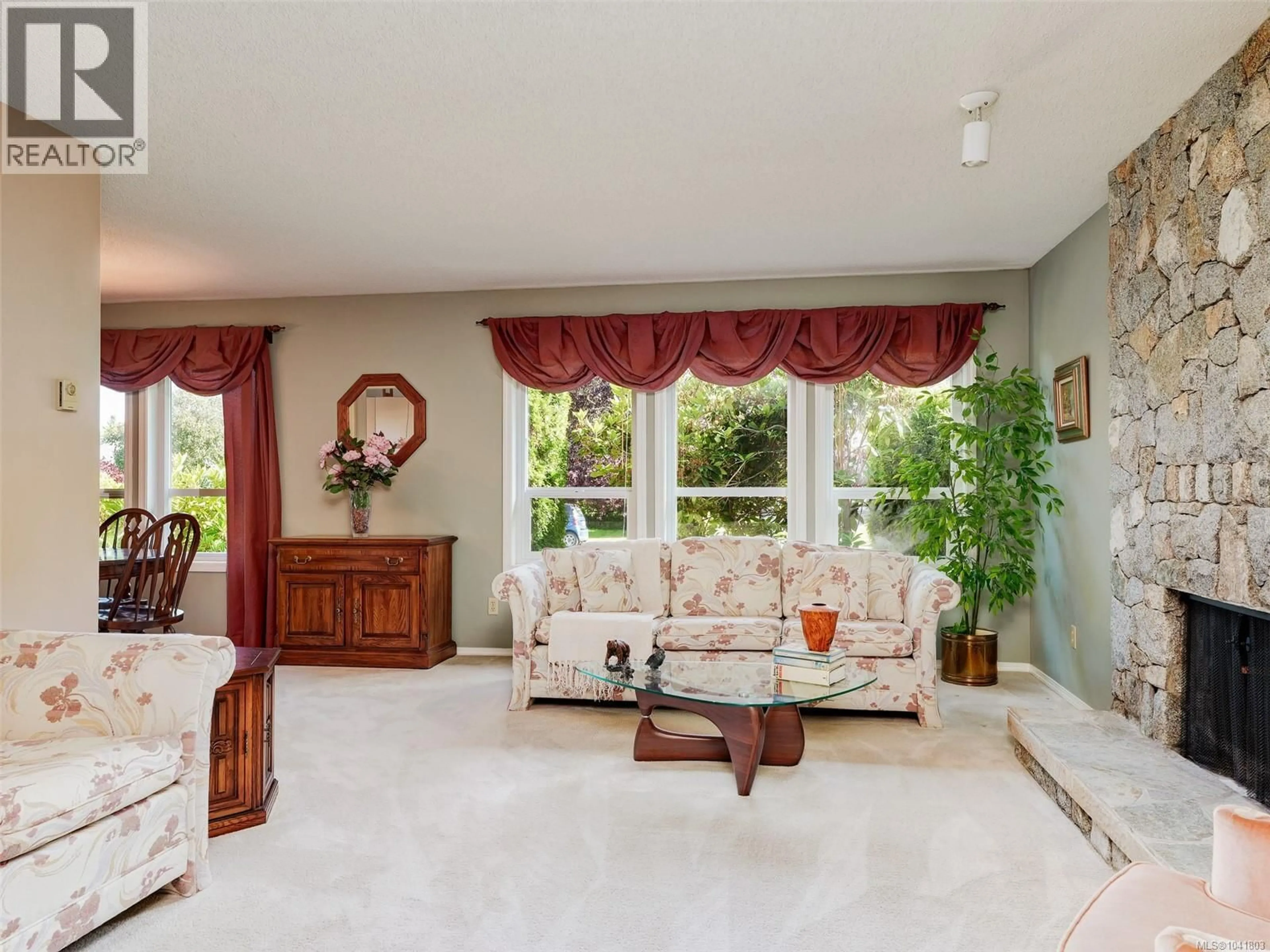 Living room with furniture, ceramic/tile floor for 4813 SUNNYGROVE PLACE, Saanich British Columbia V8Y2V8