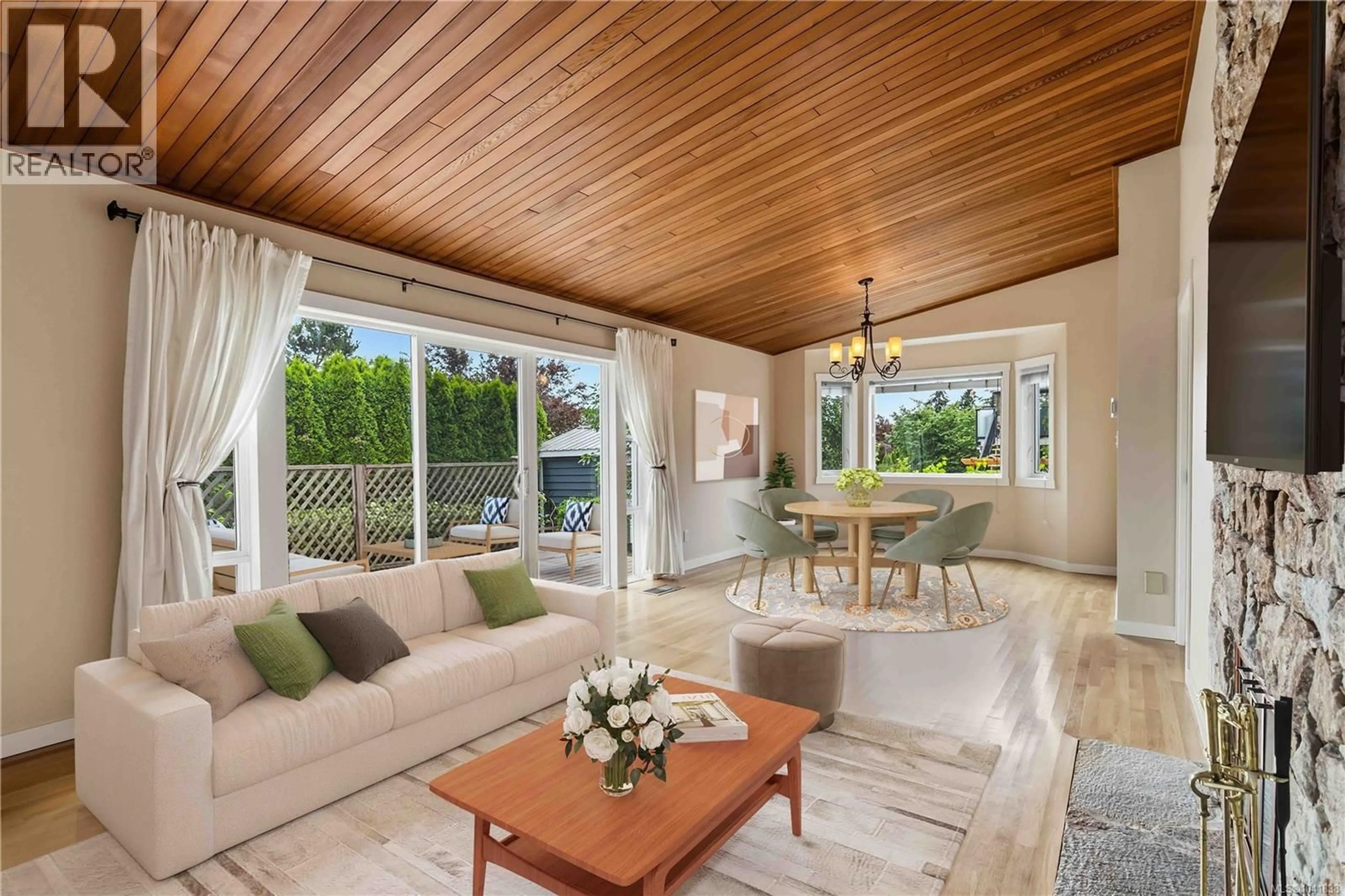 Living room with furniture, wood/laminate floor for 1131 HOLLY PARK ROAD, Central Saanich British Columbia V8M1E6