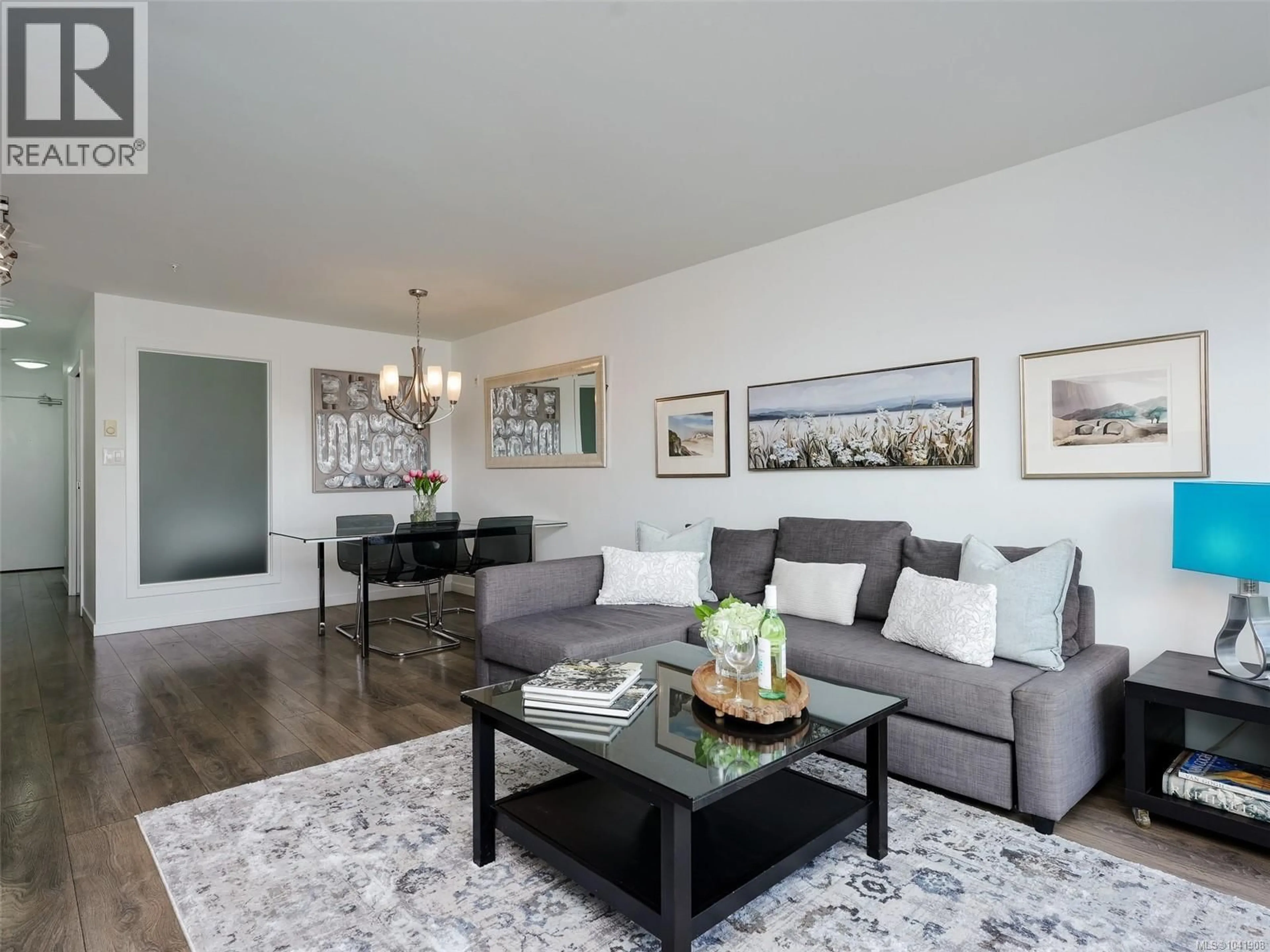 Living room with furniture, wood/laminate floor for 405 - 517 FISGARD STREET, Victoria British Columbia V8W0C5