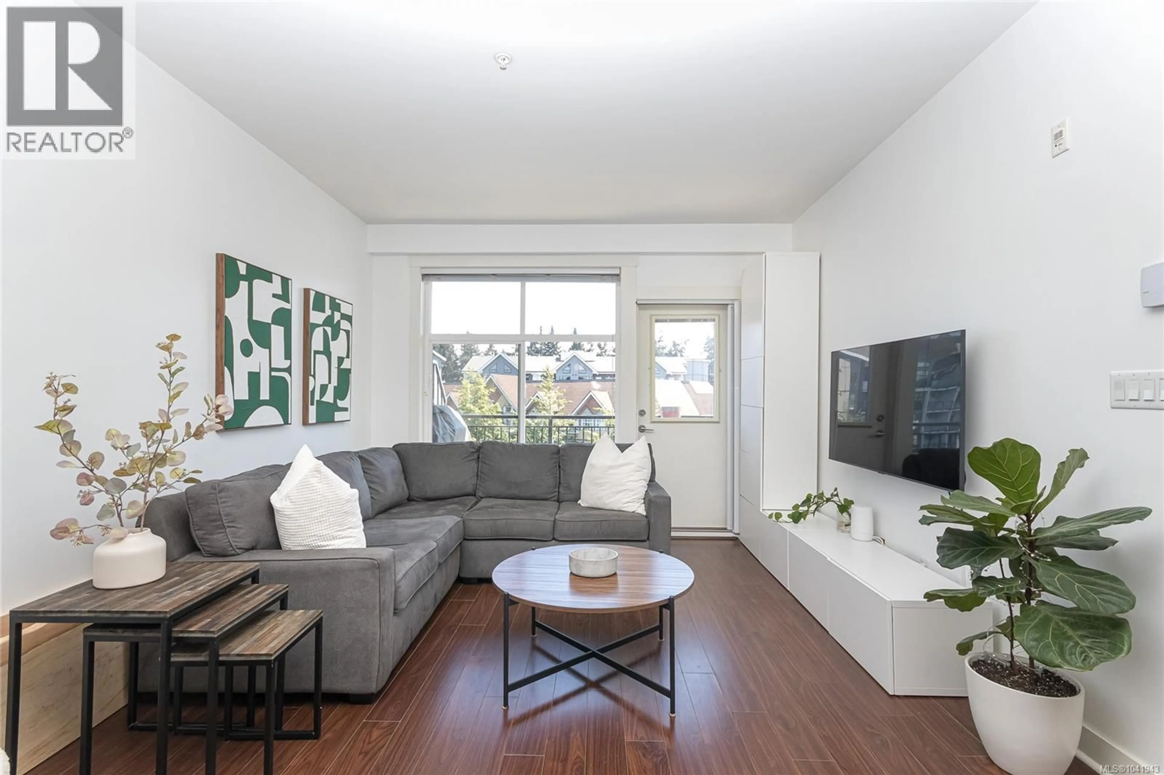 Living room with furniture, wood/laminate floor for 413 - 662 GOLDSTREAM AVENUE, Langford British Columbia V9B0N8