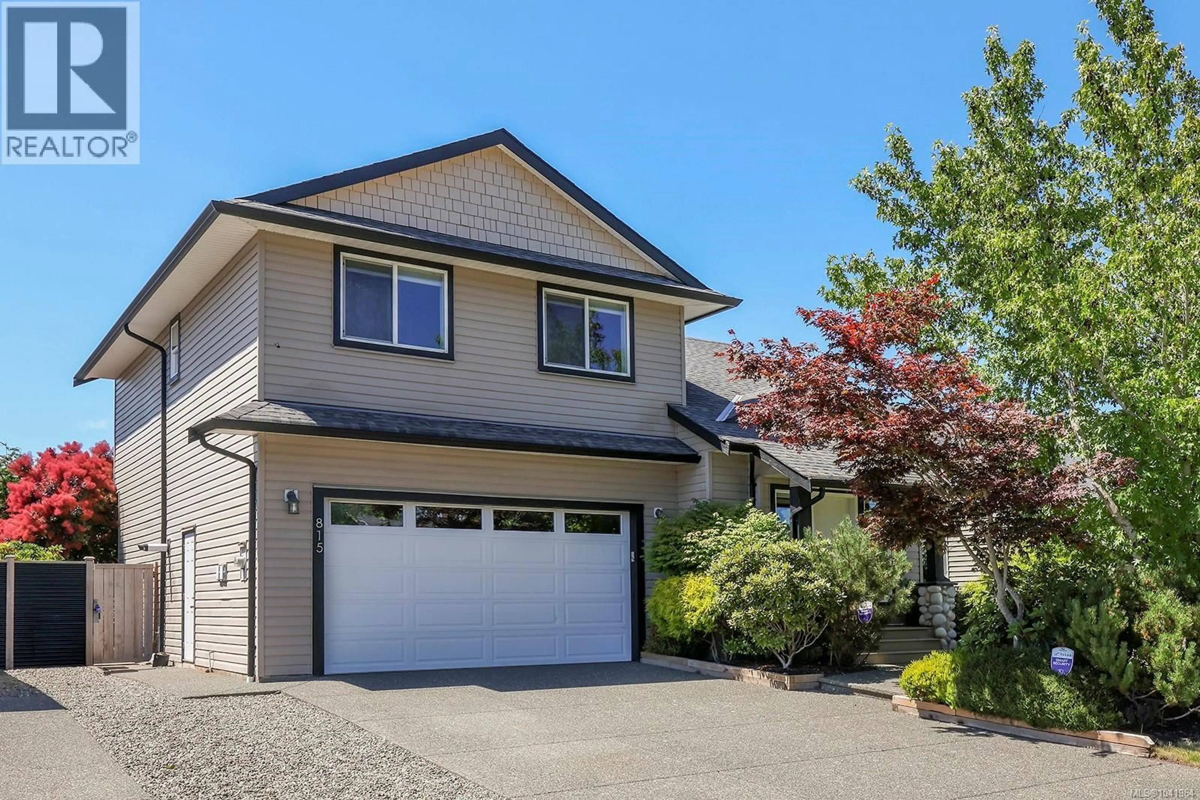 Home with vinyl exterior material, street for 815 LABRADOR DRIVE, Comox British Columbia V9M4H9