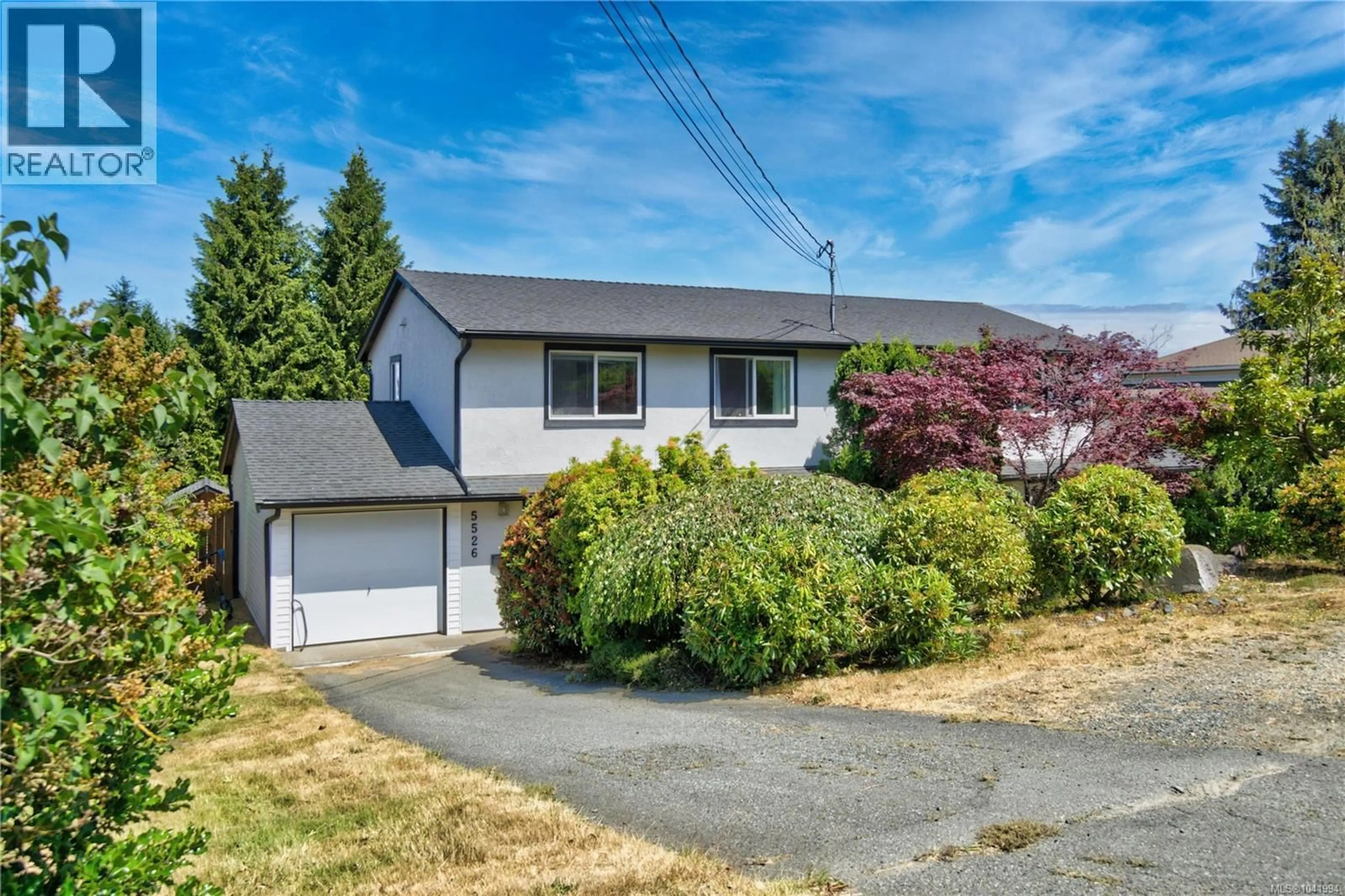 Home with vinyl exterior material, street for 5524-5526 LOST LAKE ROAD, Nanaimo British Columbia V9T5G4
