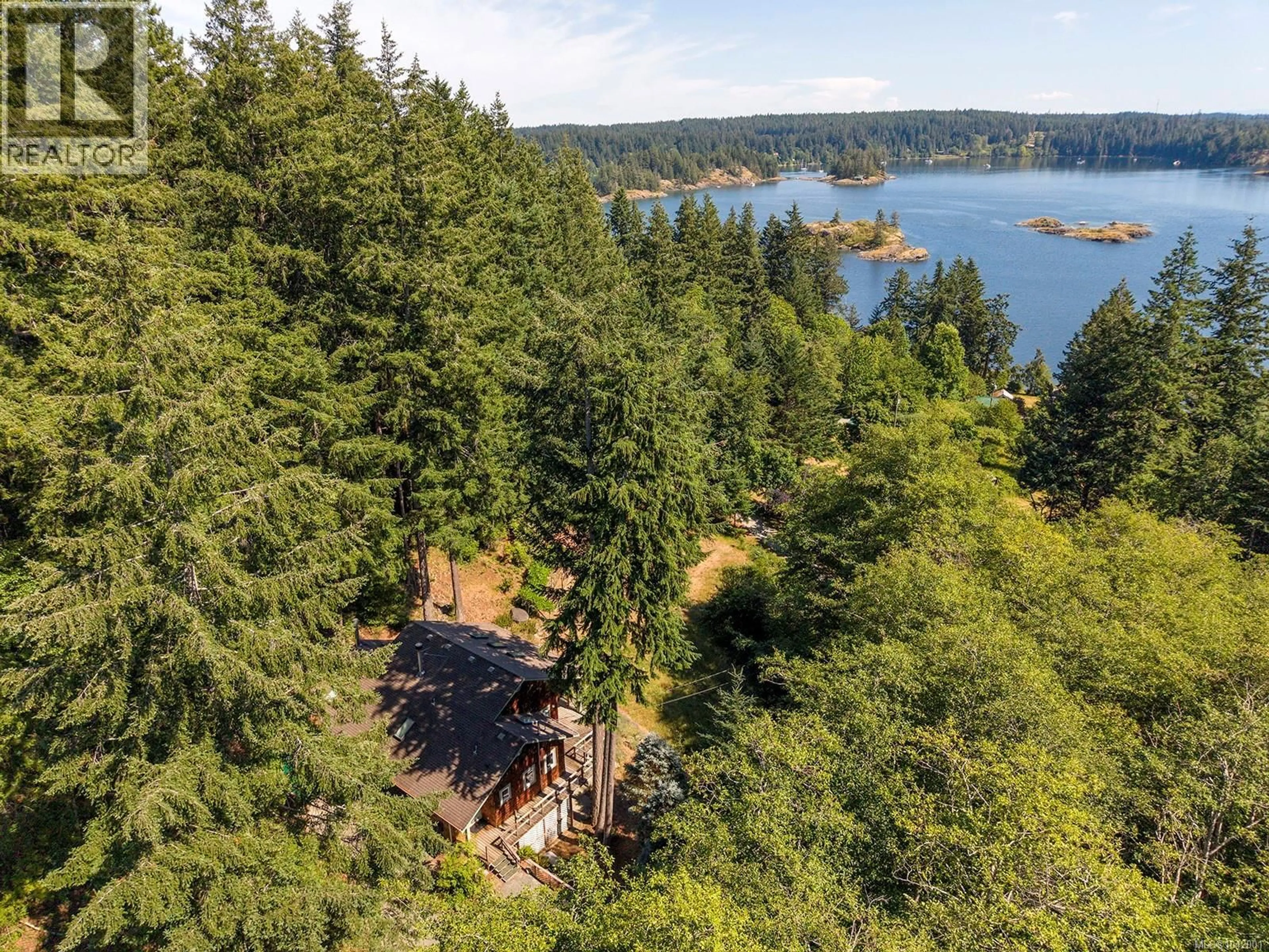 A pic from outside/outdoor area/front of a property/back of a property/a pic from drone, water/lake/river/ocean view for 865 GOWLLAND HARBOUR ROAD, Quadra Island British Columbia V0P1N0