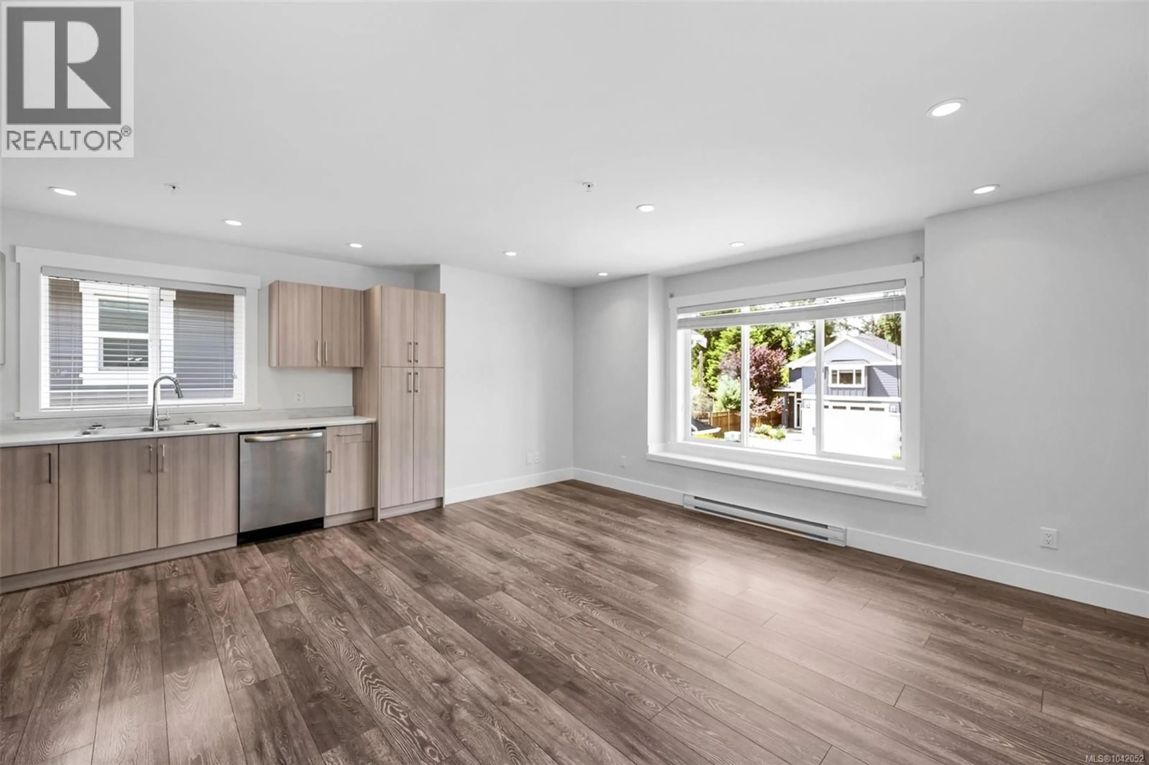 Open concept kitchen, wood/laminate floor for 1807 LIFEHOUSE COURT, Sooke British Columbia V9Z0V1