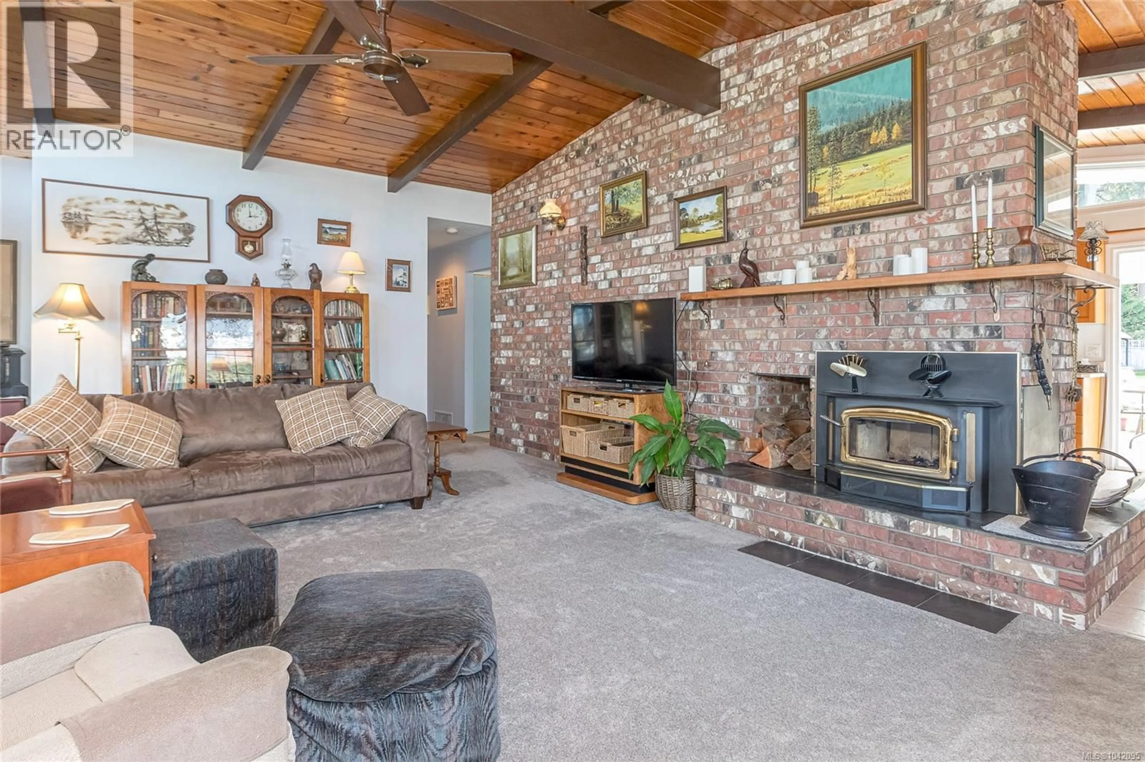 Living room with furniture, ceramic/tile floor for 5340 GAINSBERG ROAD, Bowser British Columbia V0R1G0