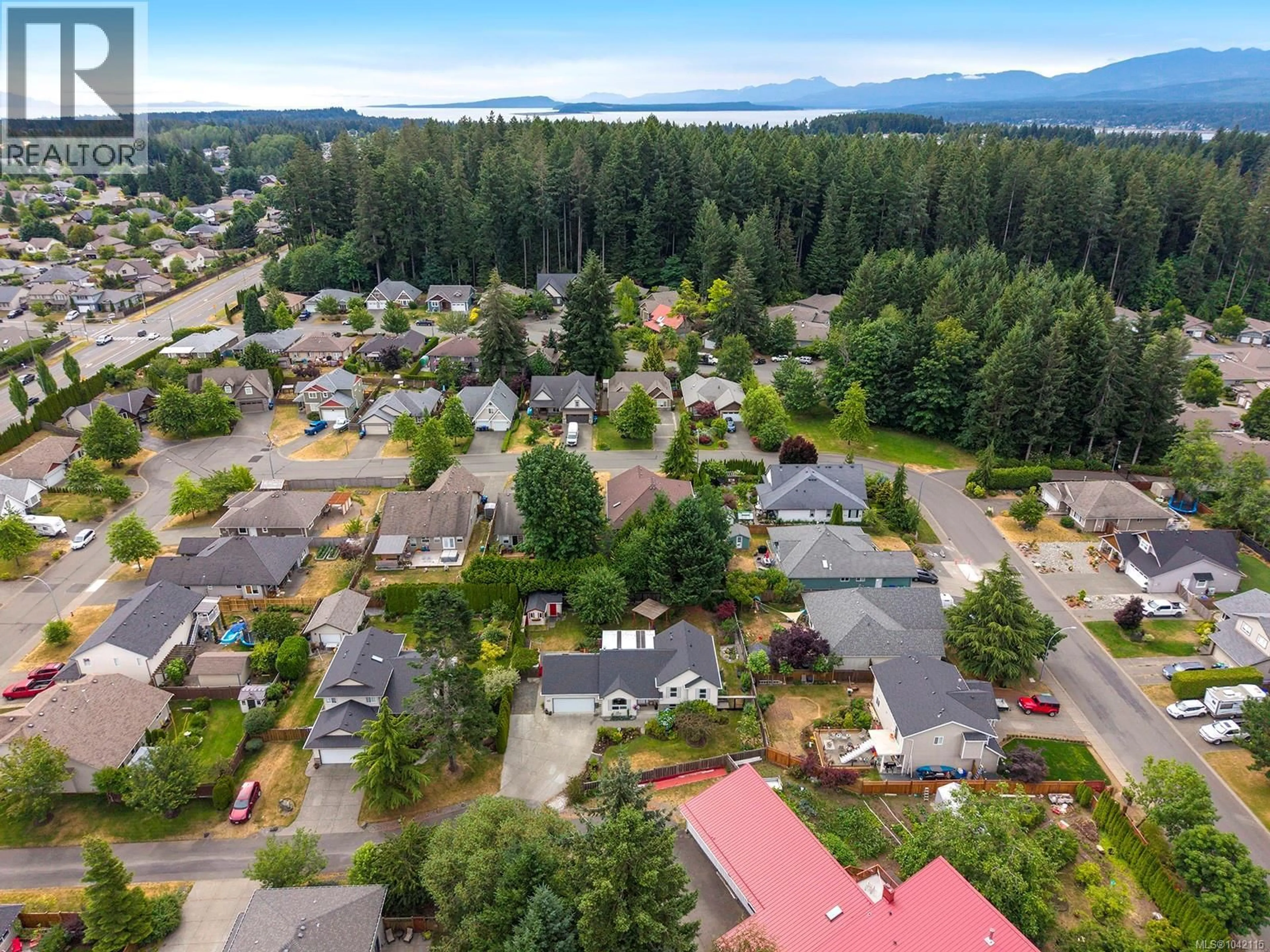 A pic from outside/outdoor area/front of a property/back of a property/a pic from drone, mountain view for 2157 SWALLOW CRESCENT, Courtenay British Columbia V9N9W5