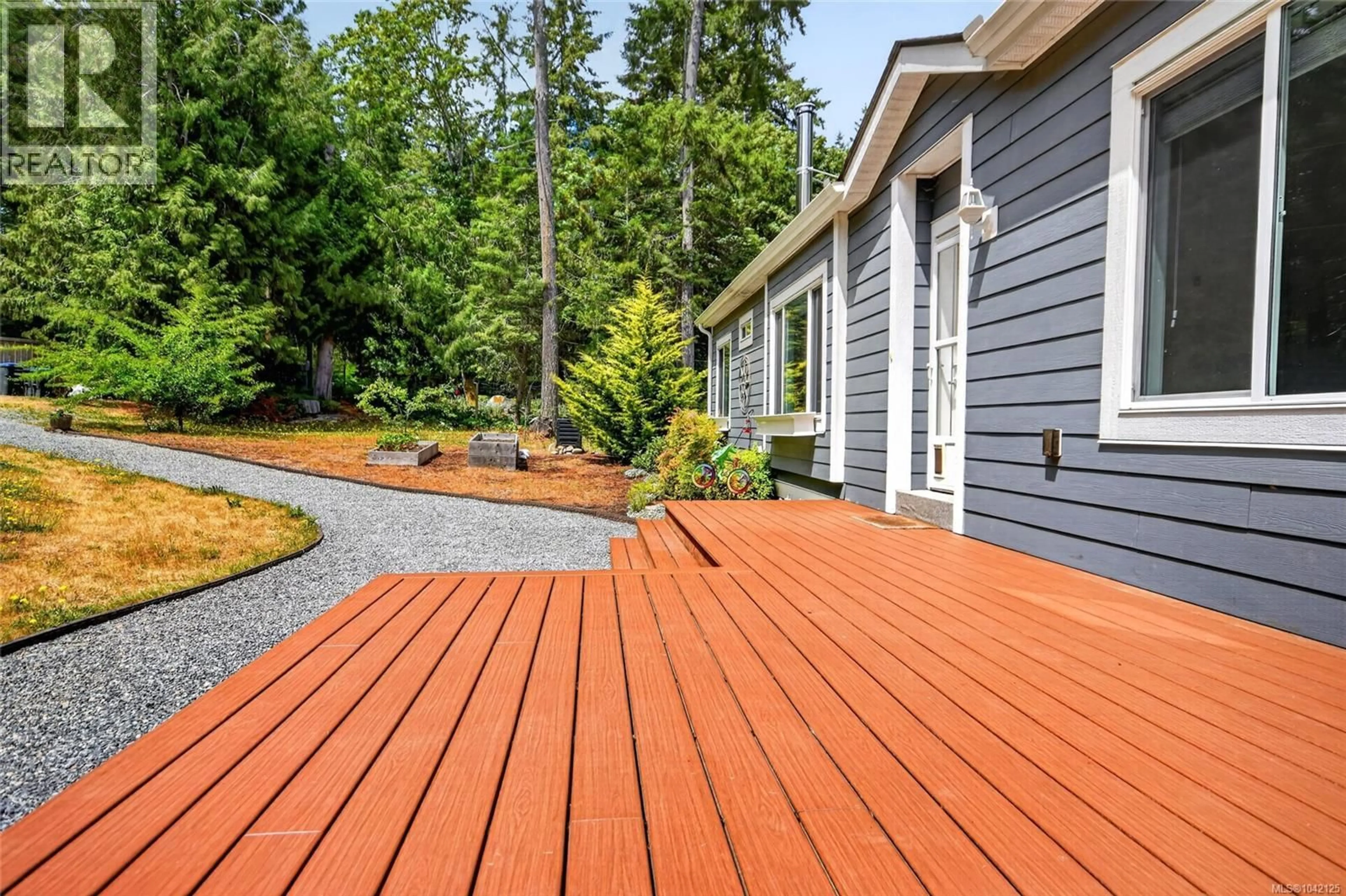Home with vinyl exterior material, street for 896 CANSO ROAD, Gabriola Island British Columbia V0R1X2