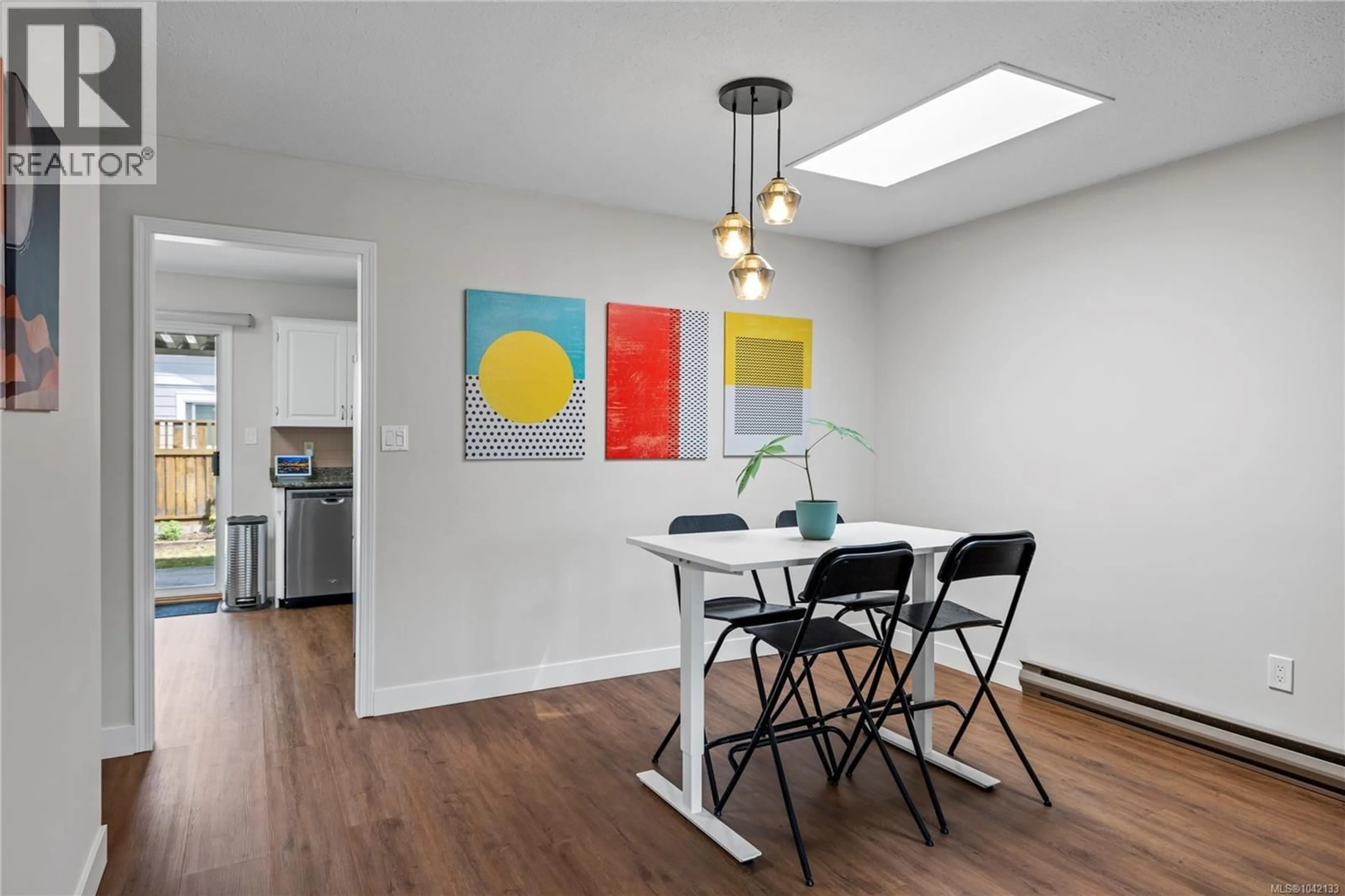 Dining room, wood/laminate floor for 763 CAMELLIA PLACE, Parksville British Columbia V9P1E6
