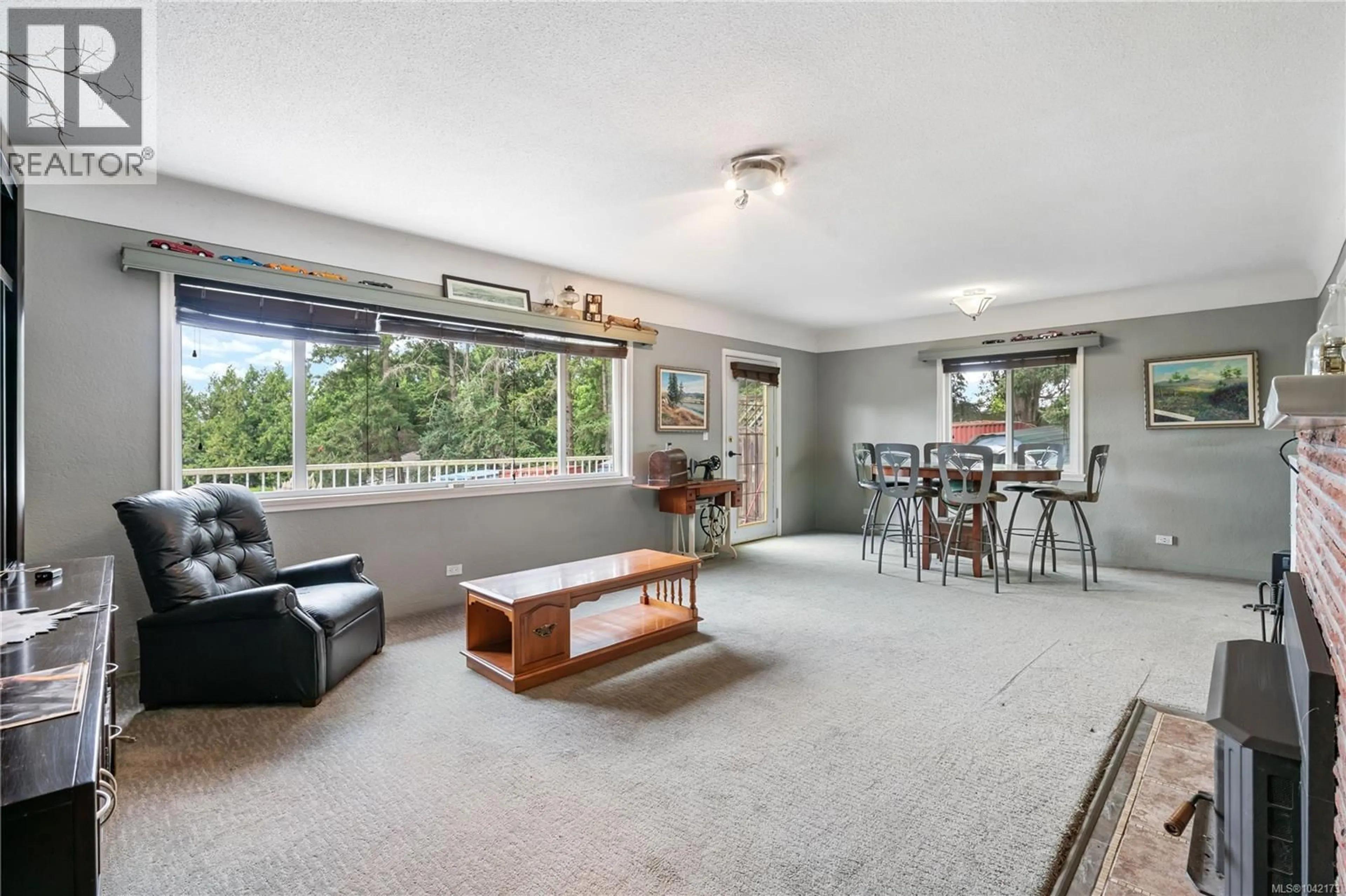 Living room with furniture, unknown for 4511 PACHENA PLACE, Saanich British Columbia V8X2P1
