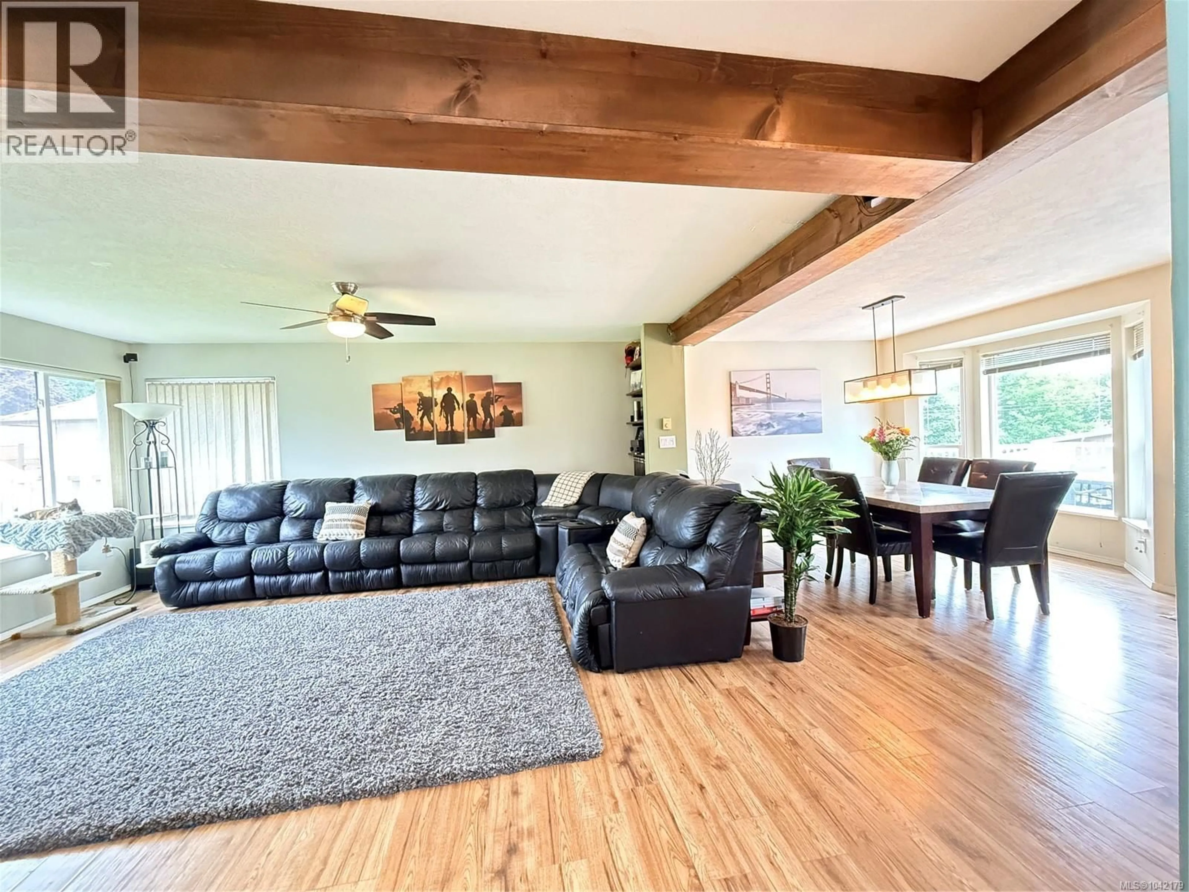 Living room with furniture, wood/laminate floor for 2116 NORTHLAND ROAD, Port McNeill British Columbia V0N2R0