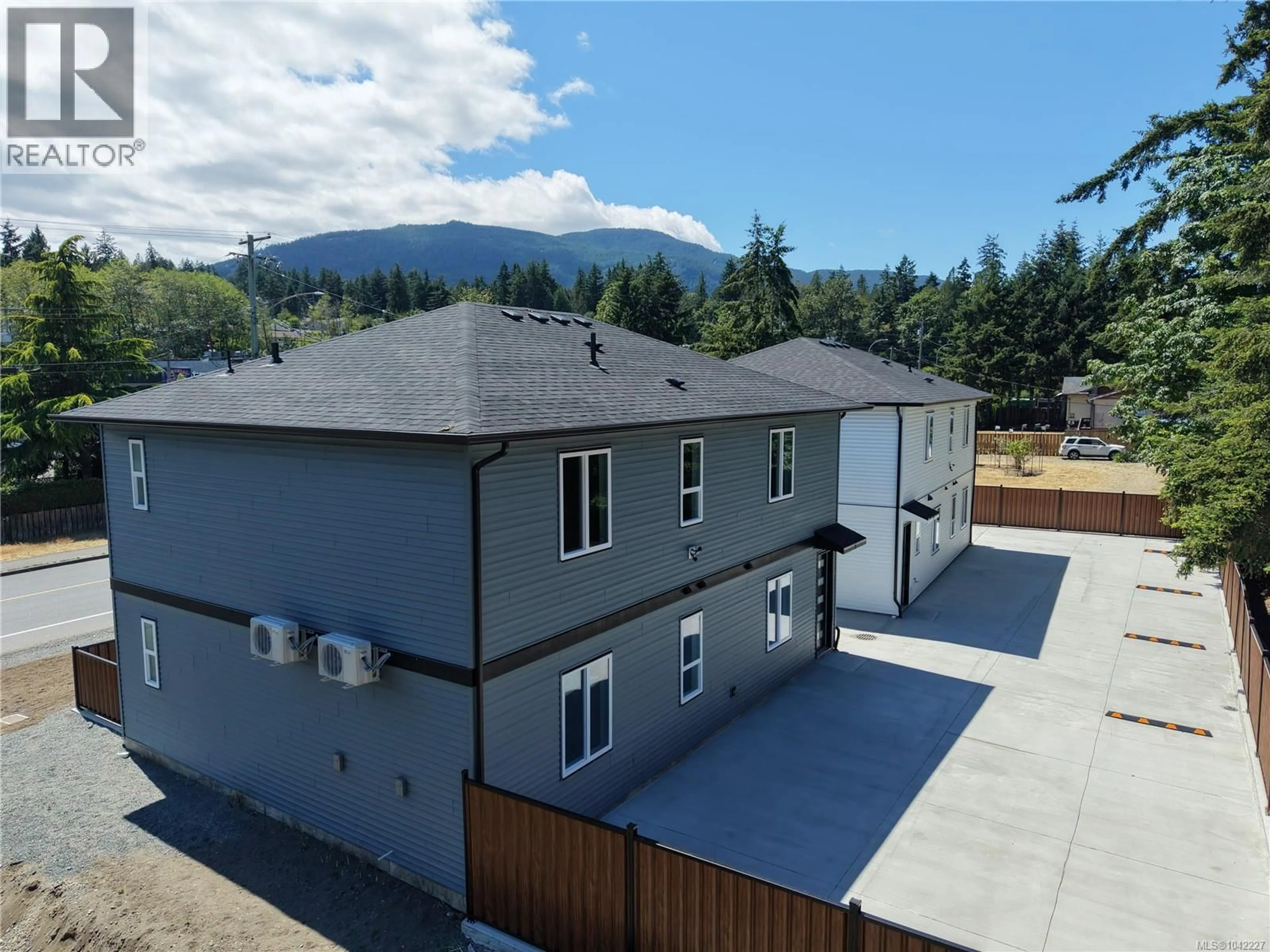 A pic from outside/outdoor area/front of a property/back of a property/a pic from drone, mountain view for 200 - 2188 JINGLE POT ROAD, Nanaimo British Columbia V9R6J2