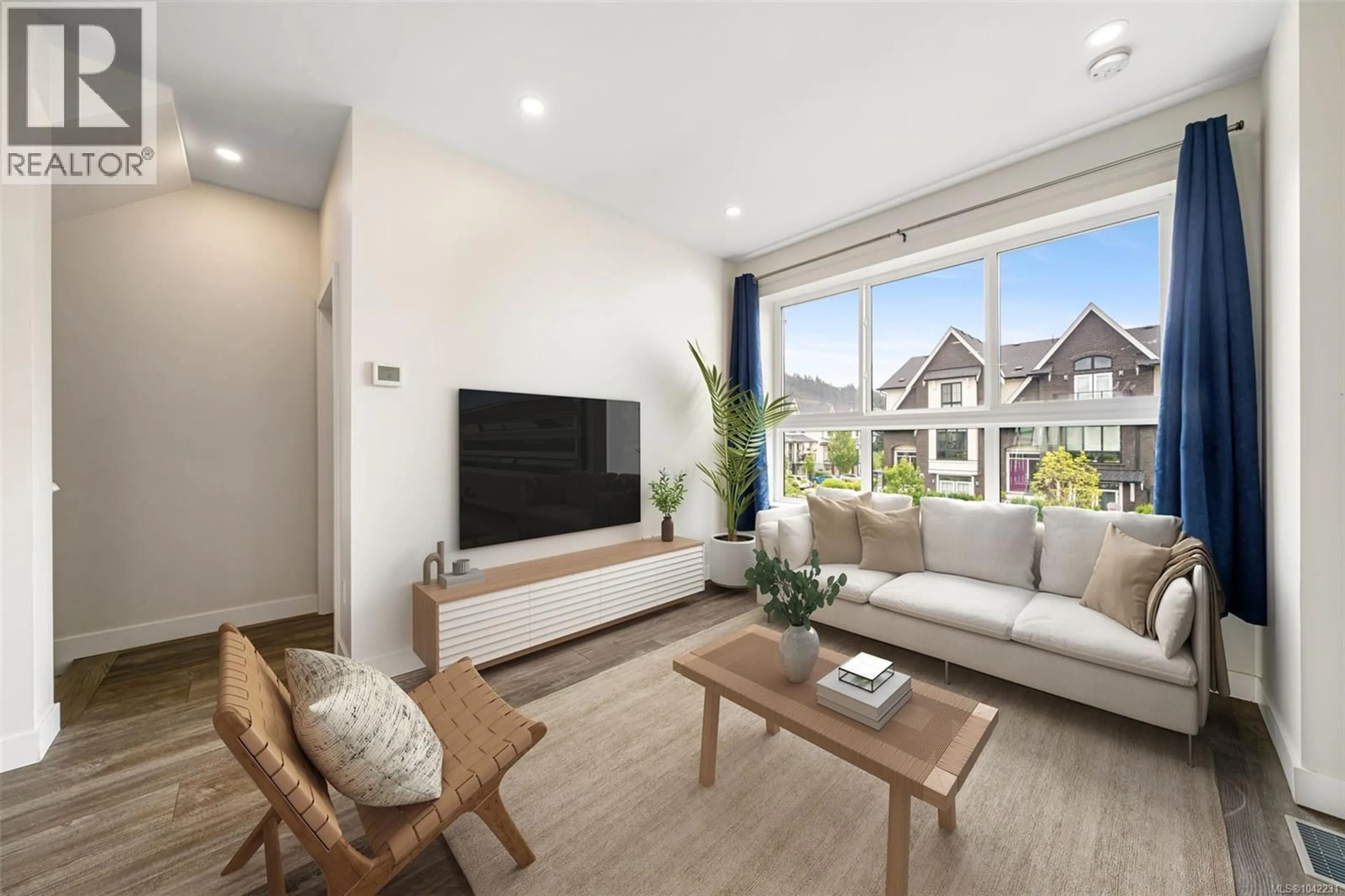 Living room with furniture, wood/laminate floor for 1029 BOXCAR CLOSE, Langford British Columbia V9B0Y4