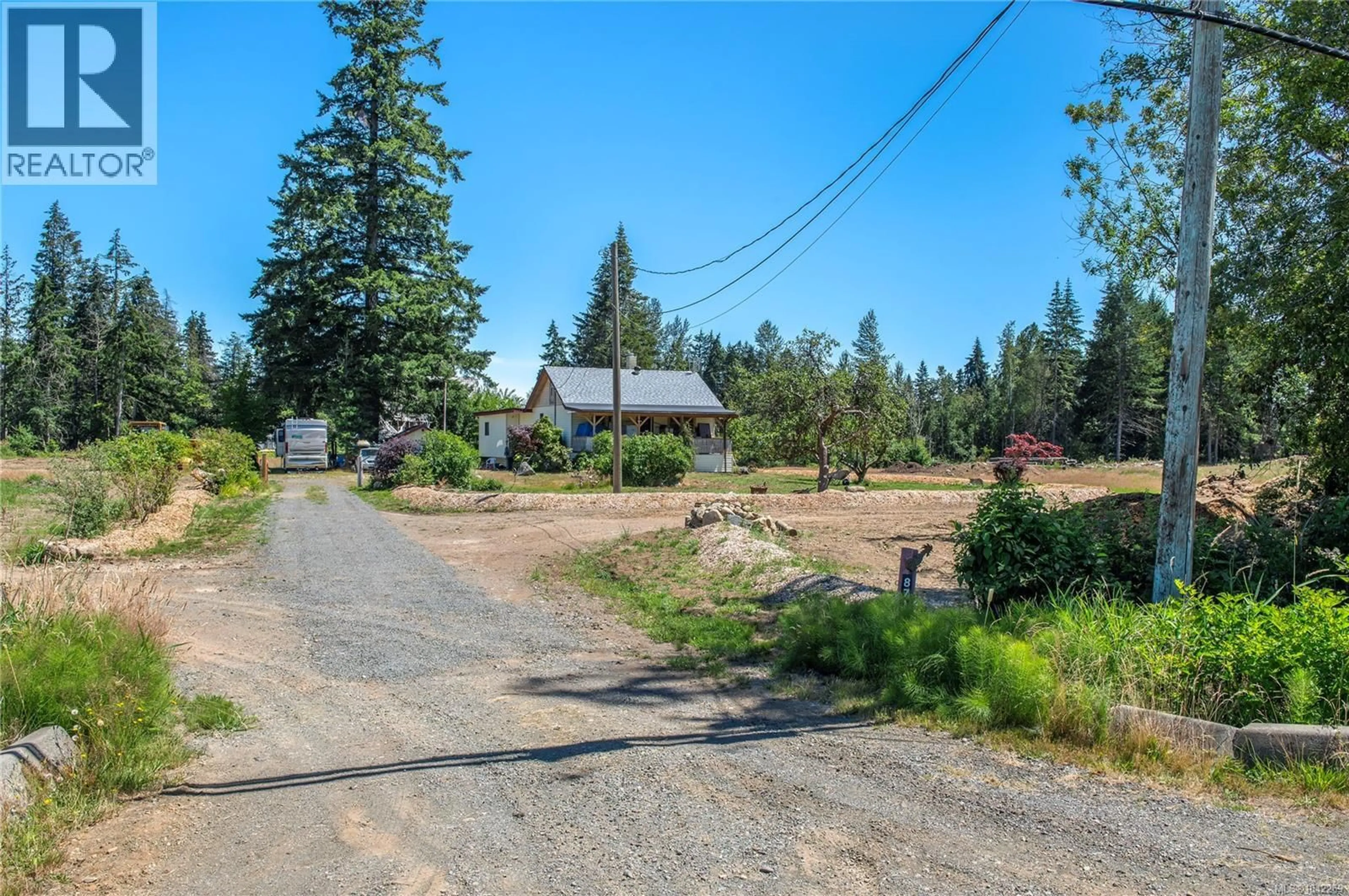 A pic from outside/outdoor area/front of a property/back of a property/a pic from drone, street for 8712 ISLAND HIGHWAY NORTH, Black Creek British Columbia V0R1C0
