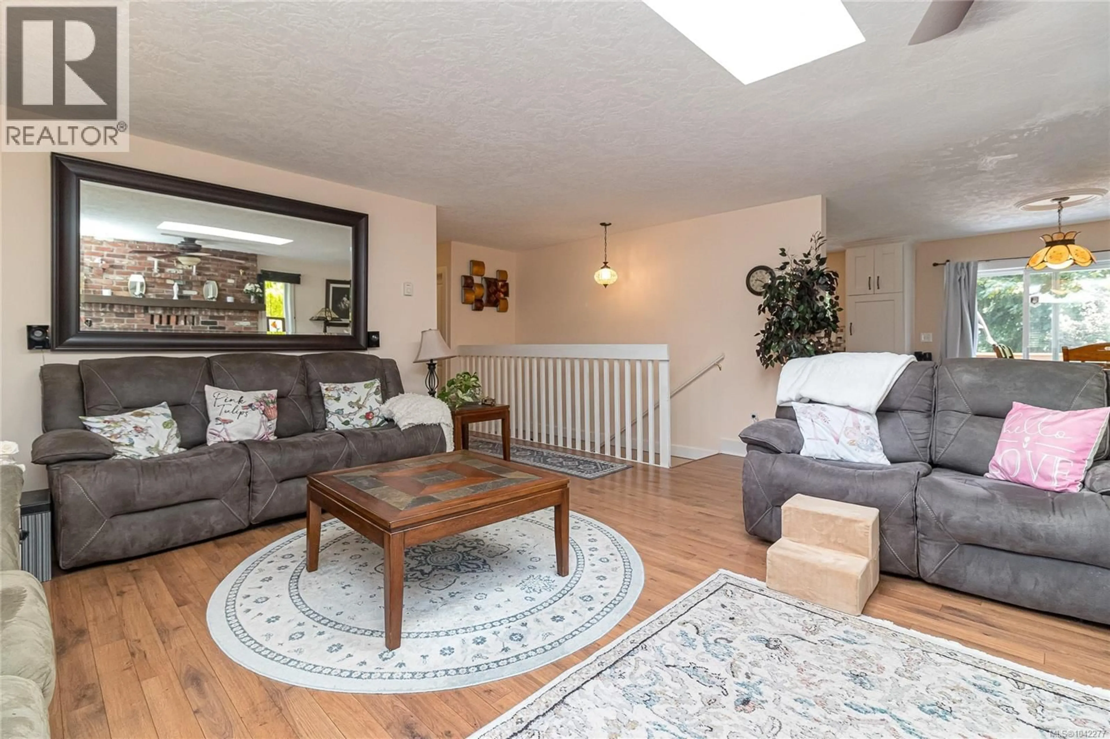 Living room with furniture, wood/laminate floor for 2909 CRESSIDA CRESCENT, Langford British Columbia V8X3X2