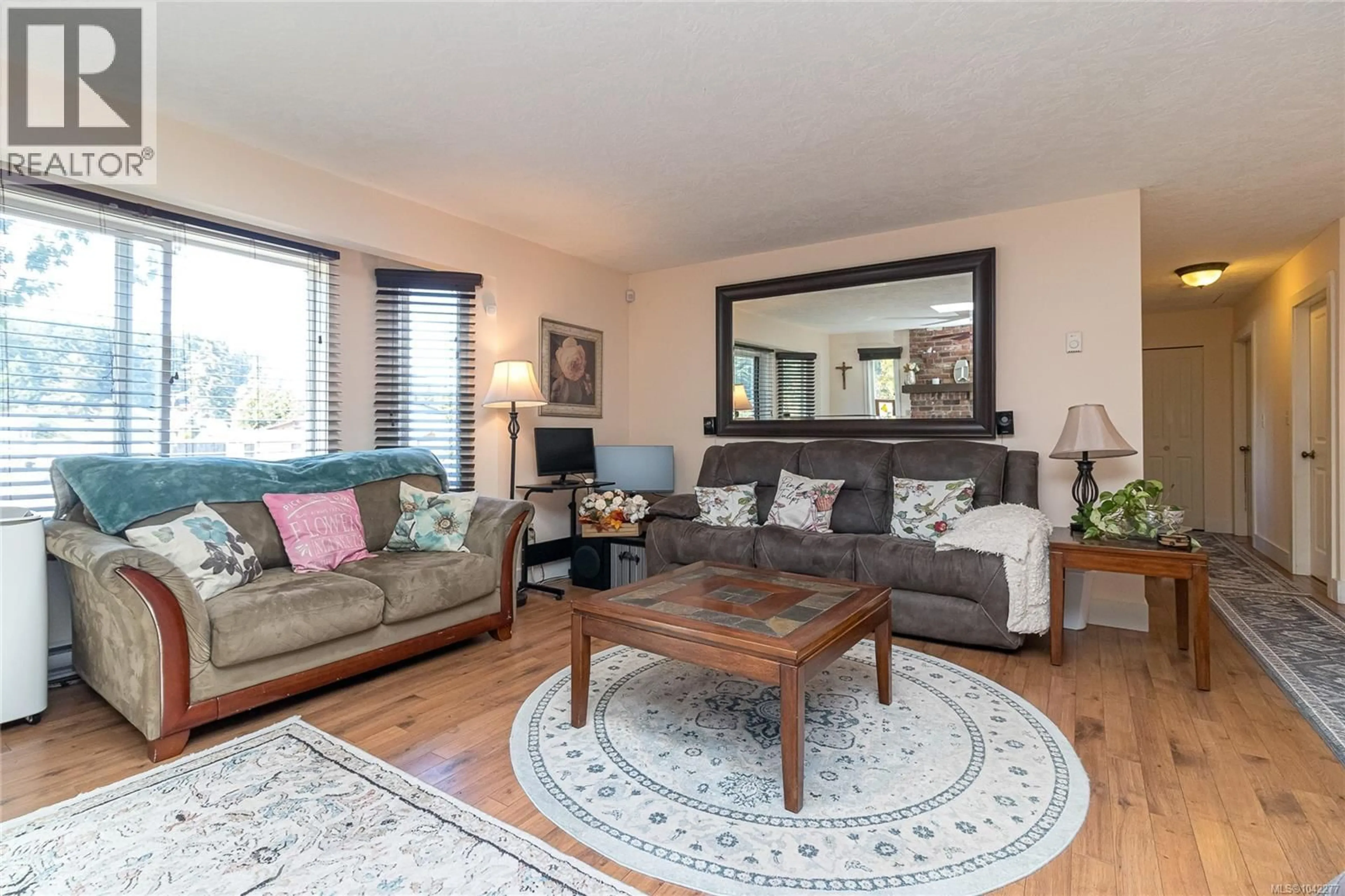 Living room with furniture, wood/laminate floor for 2909 CRESSIDA CRESCENT, Langford British Columbia V8X3X2
