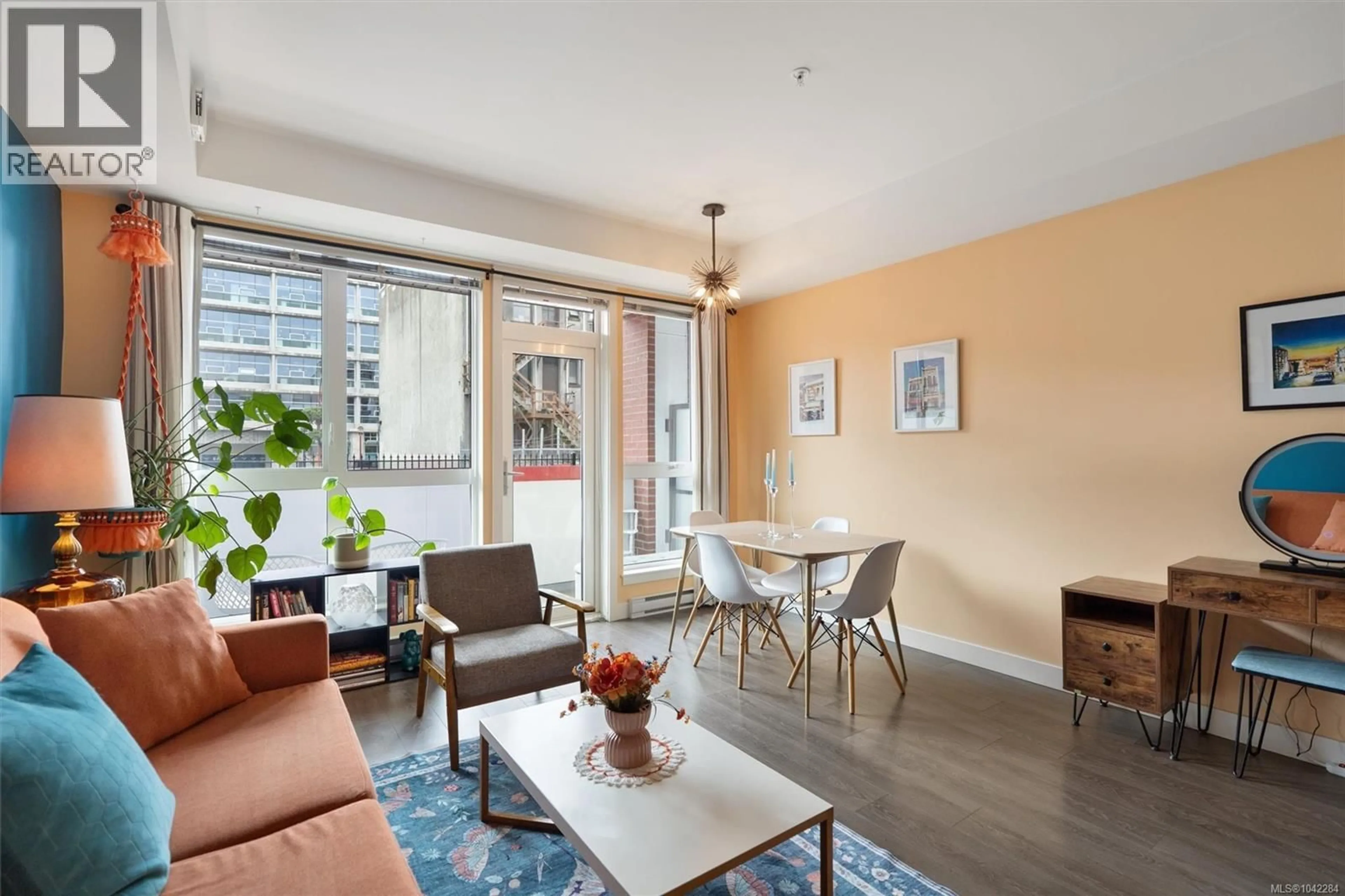 Living room with furniture, wood/laminate floor for 206 - 613 HERALD STREET, Victoria British Columbia V8W1S8