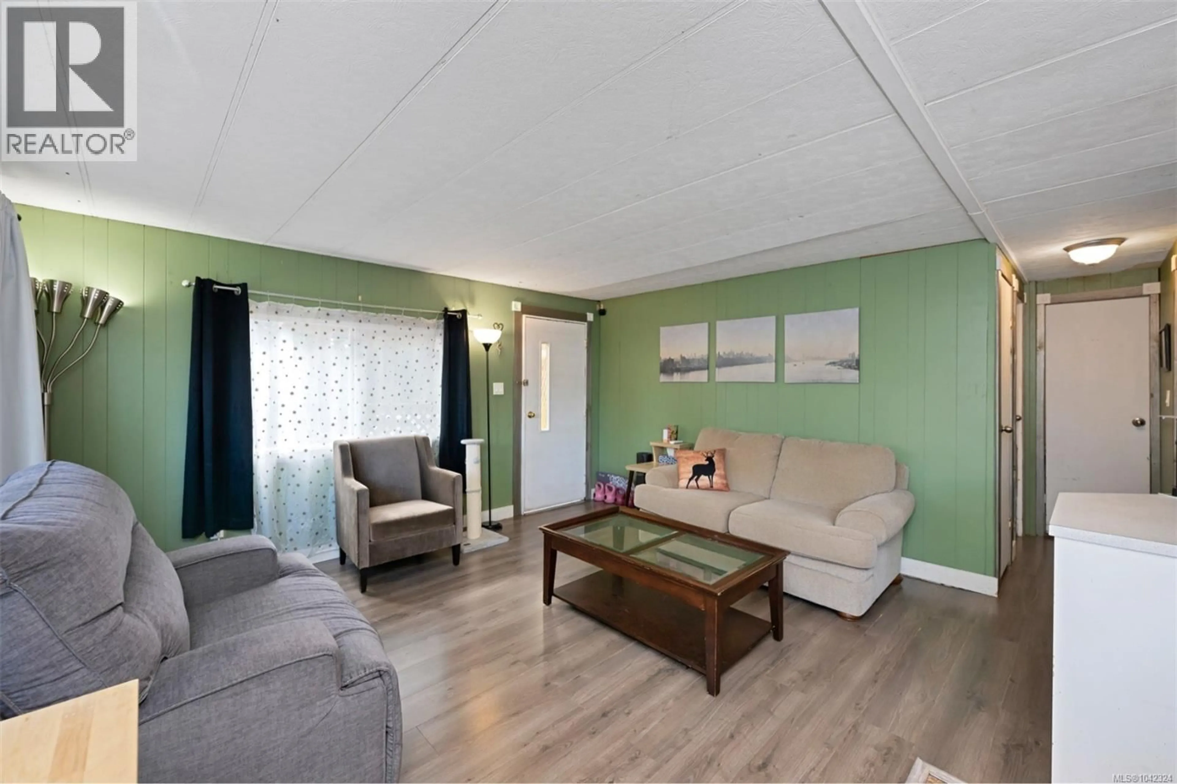 Living room with furniture, wood/laminate floor for 22 - 1540 COWICHAN BAY ROAD, Cowichan Bay British Columbia V0R1N1