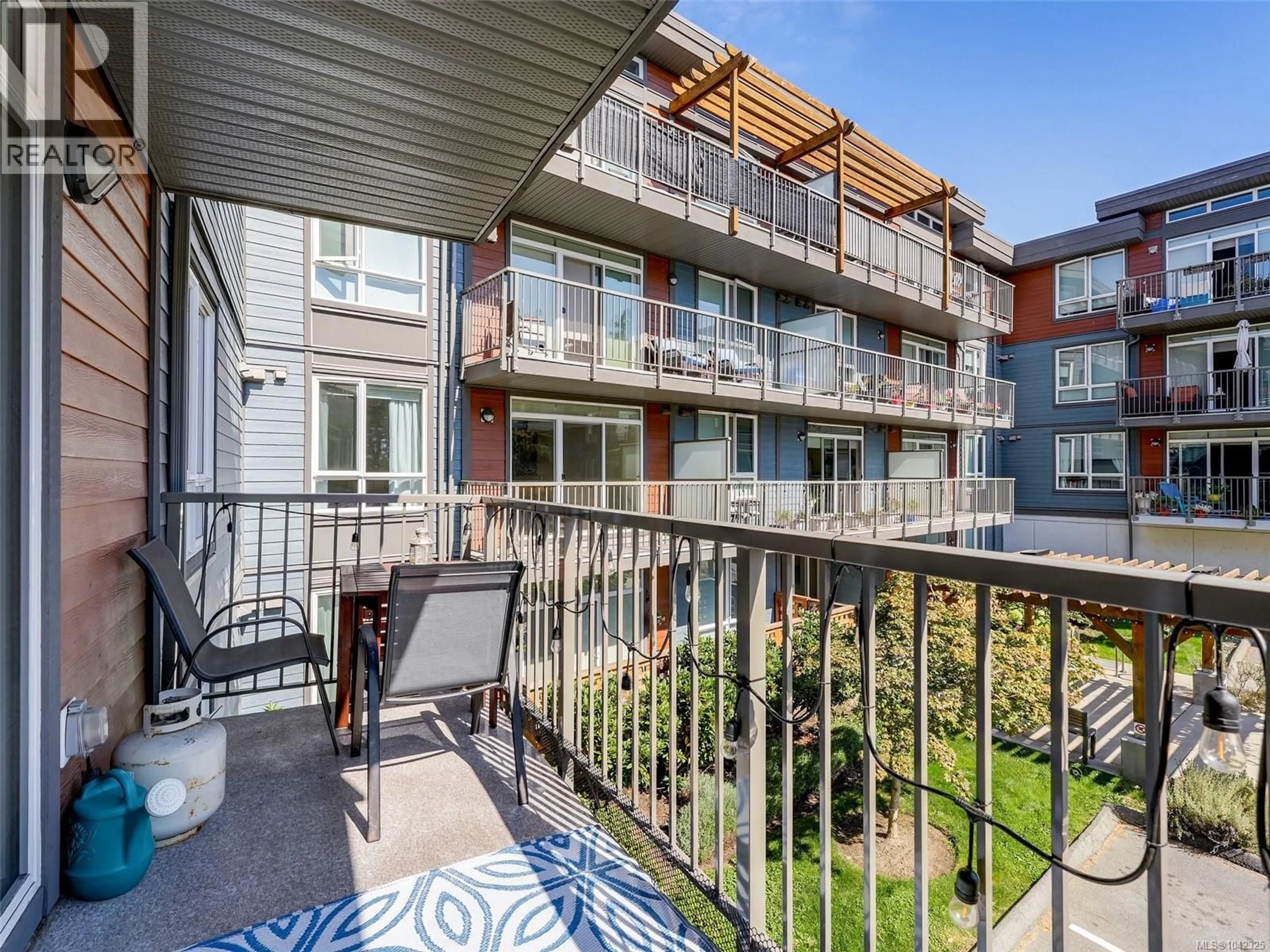 Balcony in the apartment, city buildings view from balcony for 212 - 110 PRESLEY PLACE, View Royal British Columbia V9B0Z1