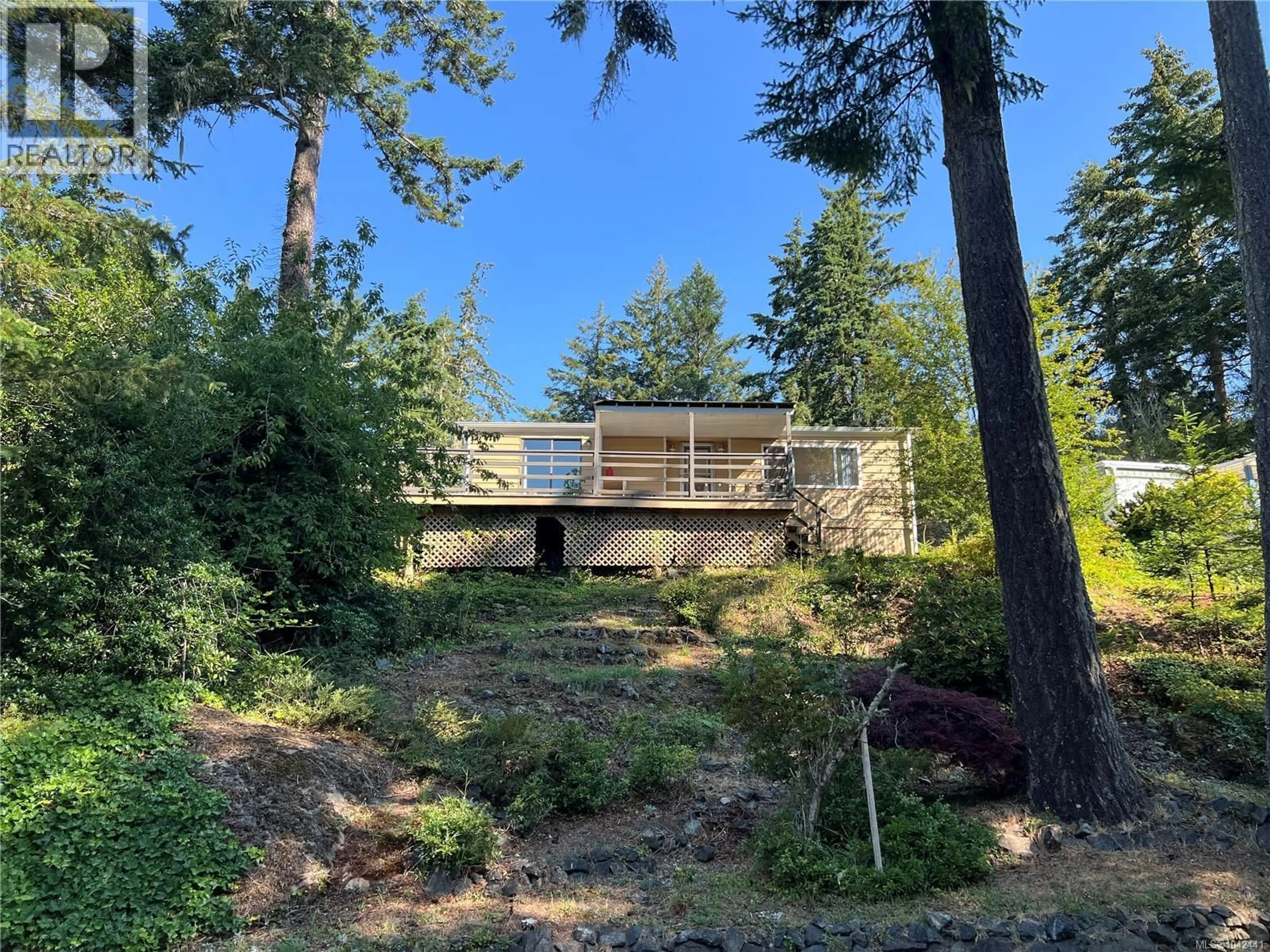 A pic from outside/outdoor area/front of a property/back of a property/a pic from drone, forest/trees view for 38 - 5838 BLYTHWOOD ROAD, Sooke British Columbia V9Z0G2