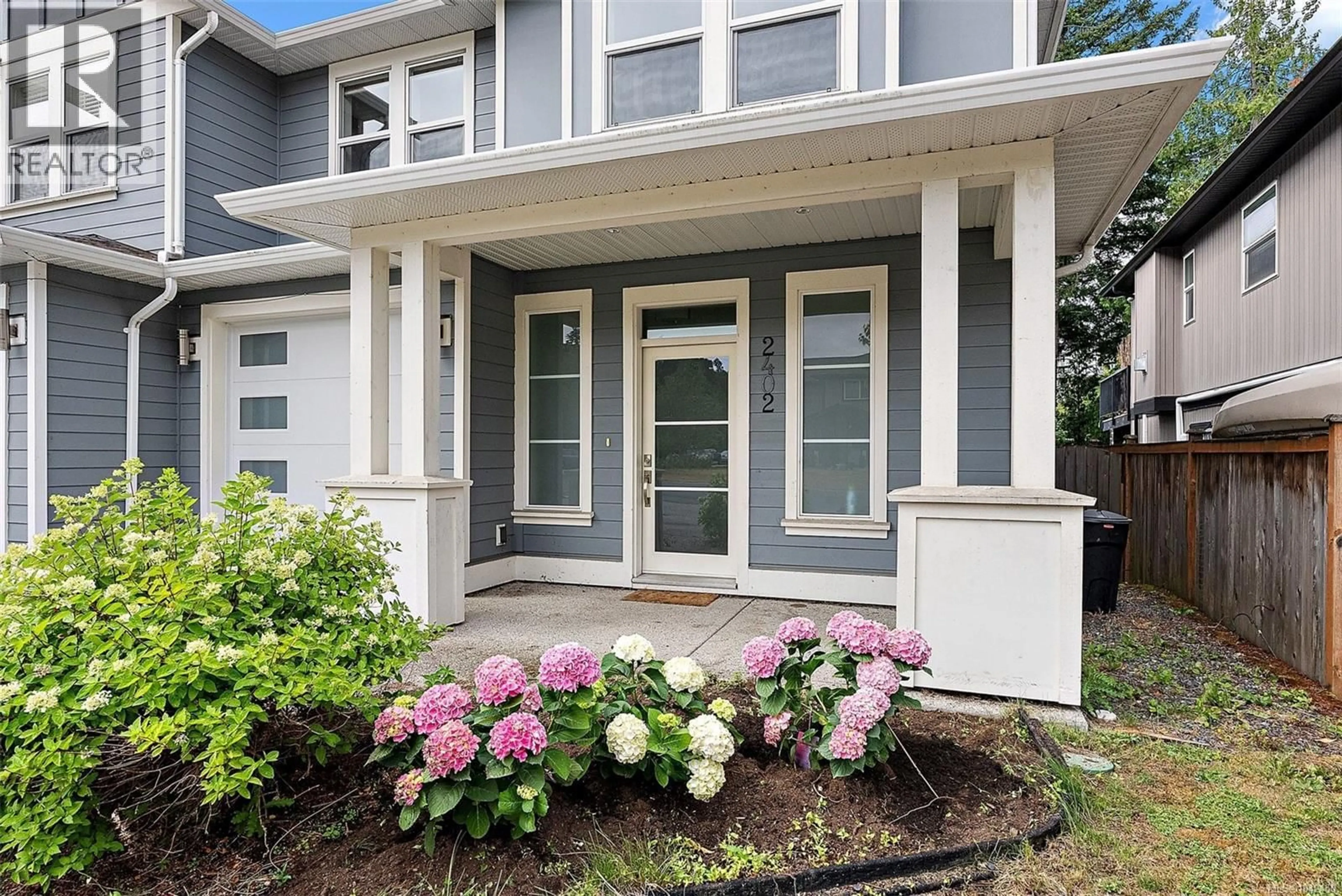 Home with vinyl exterior material, street for 2402 BELLAMY ROAD, Langford British Columbia V9B0R8