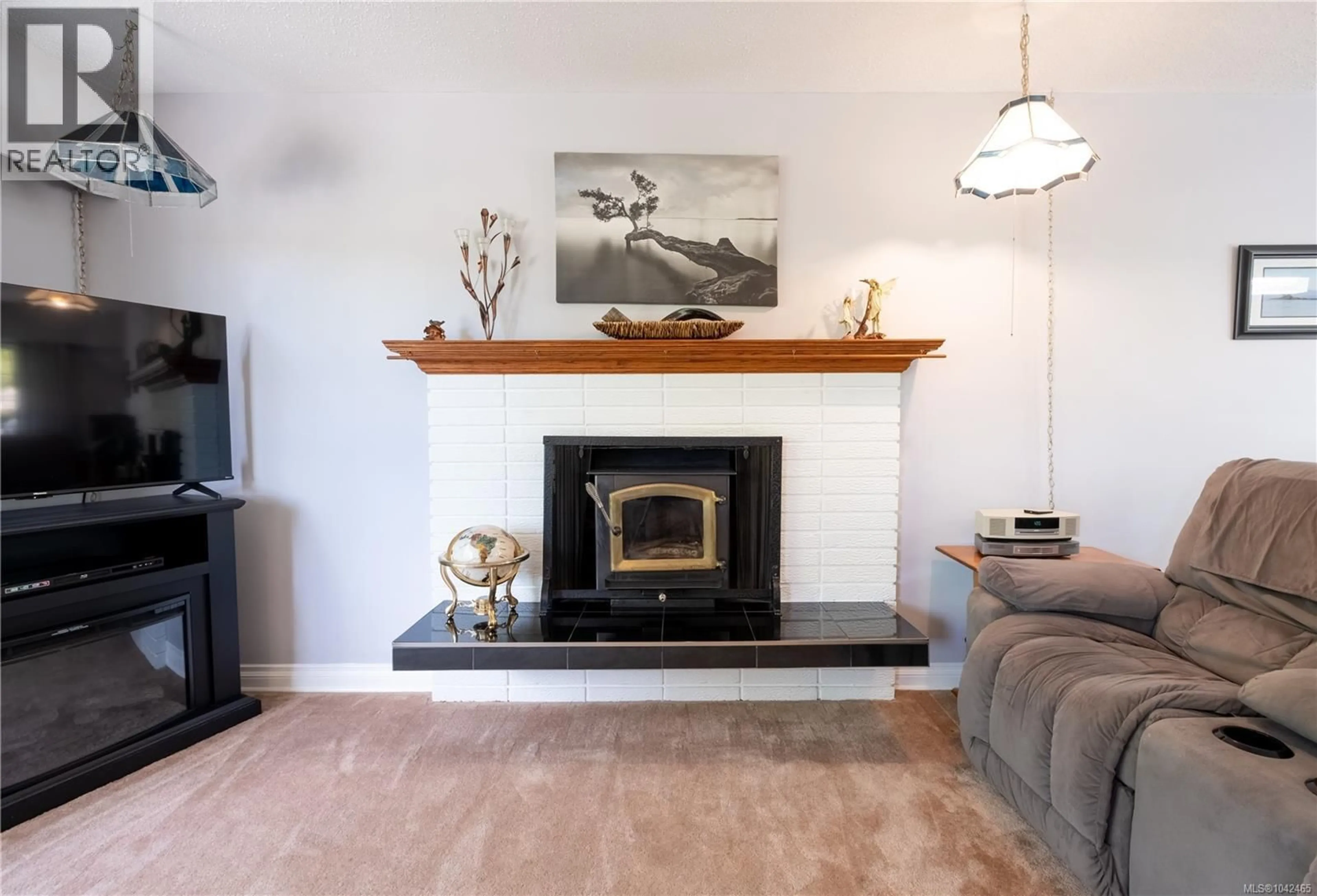 Living room with furniture, unknown for 1709 MAHTMOF PLACE, Comox British Columbia V9M2L9