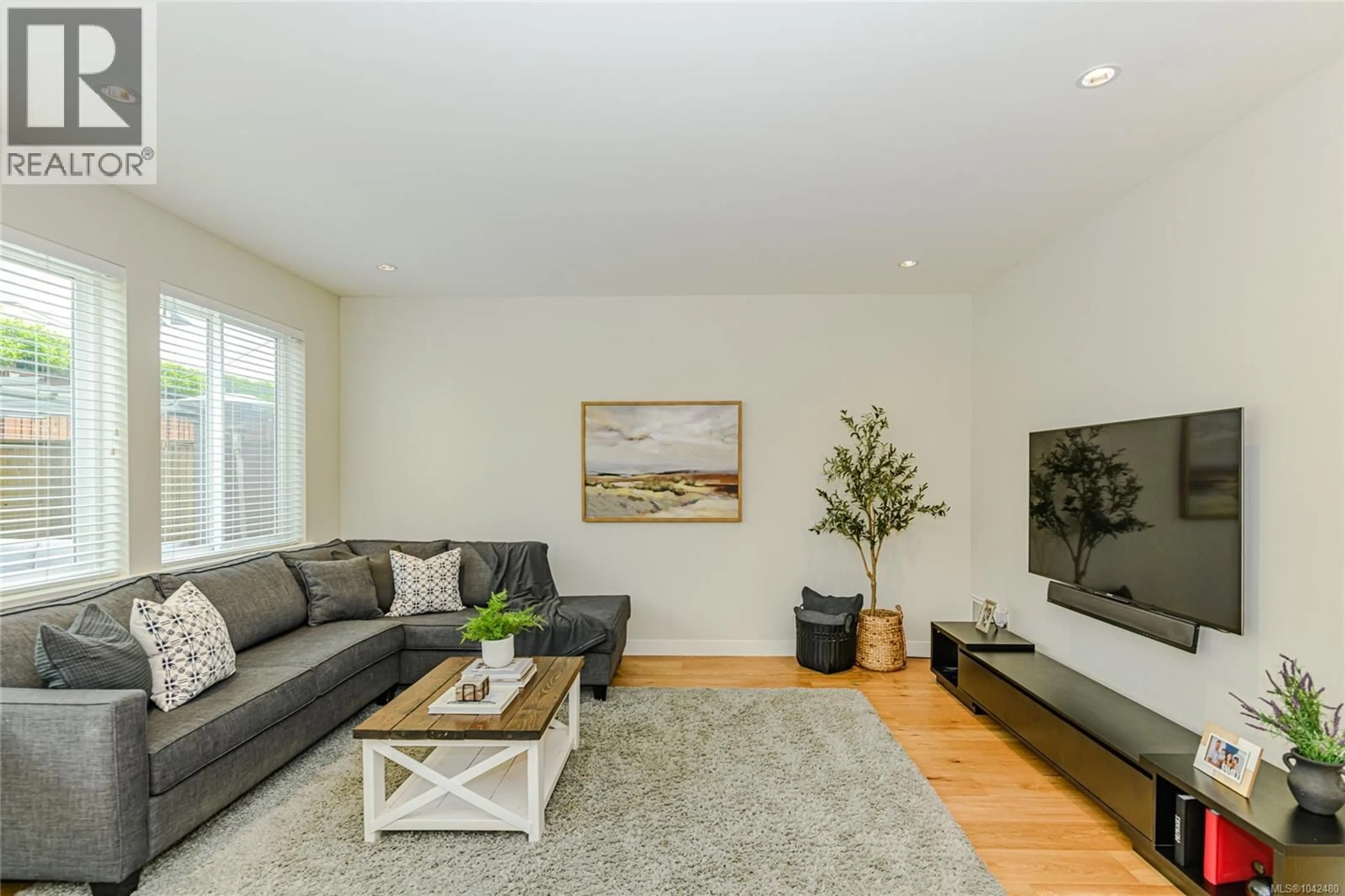 Living room with furniture, wood/laminate floor for 2922 BURLINGTON CRESCENT, Langford British Columbia V9B0K6