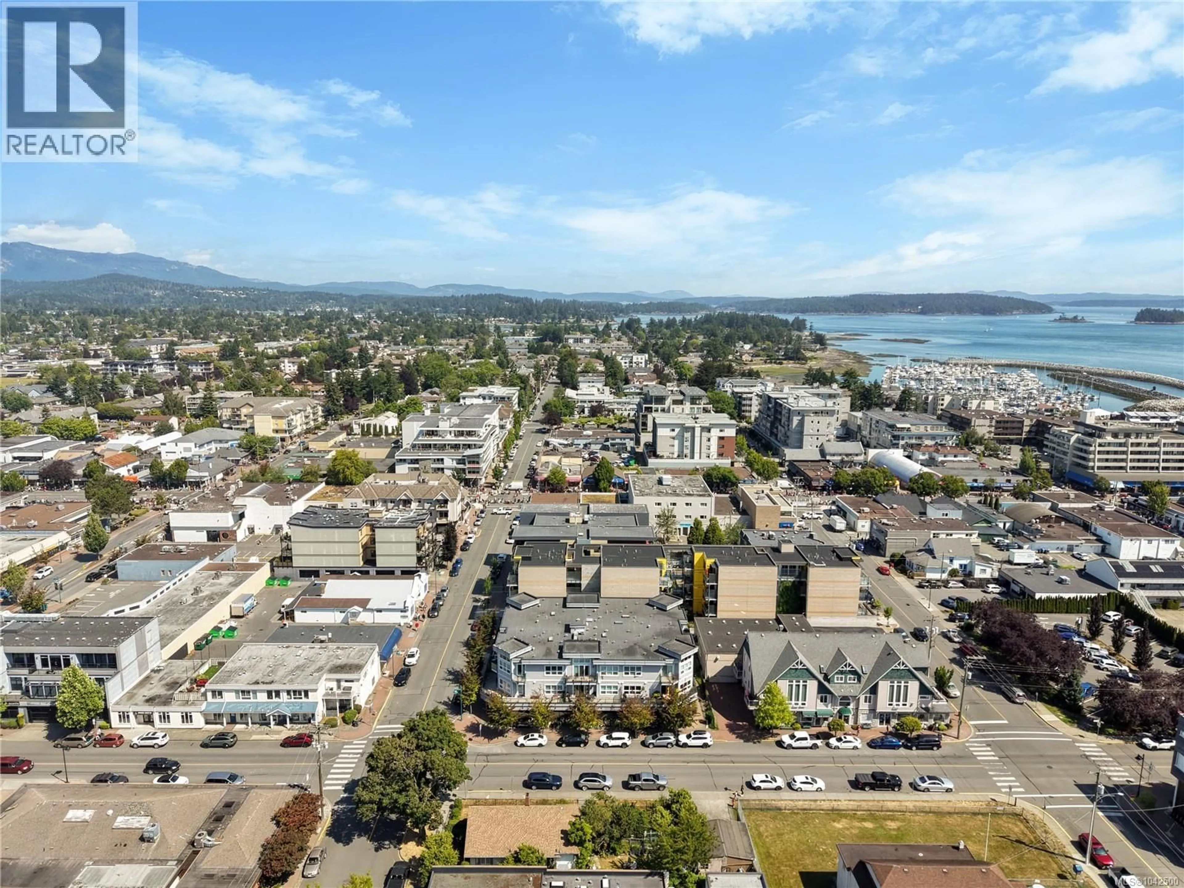 A pic from outside/outdoor area/front of a property/back of a property/a pic from drone, mountain view for 308 - 9751 FOURTH STREET, Sidney British Columbia V8L2Y9