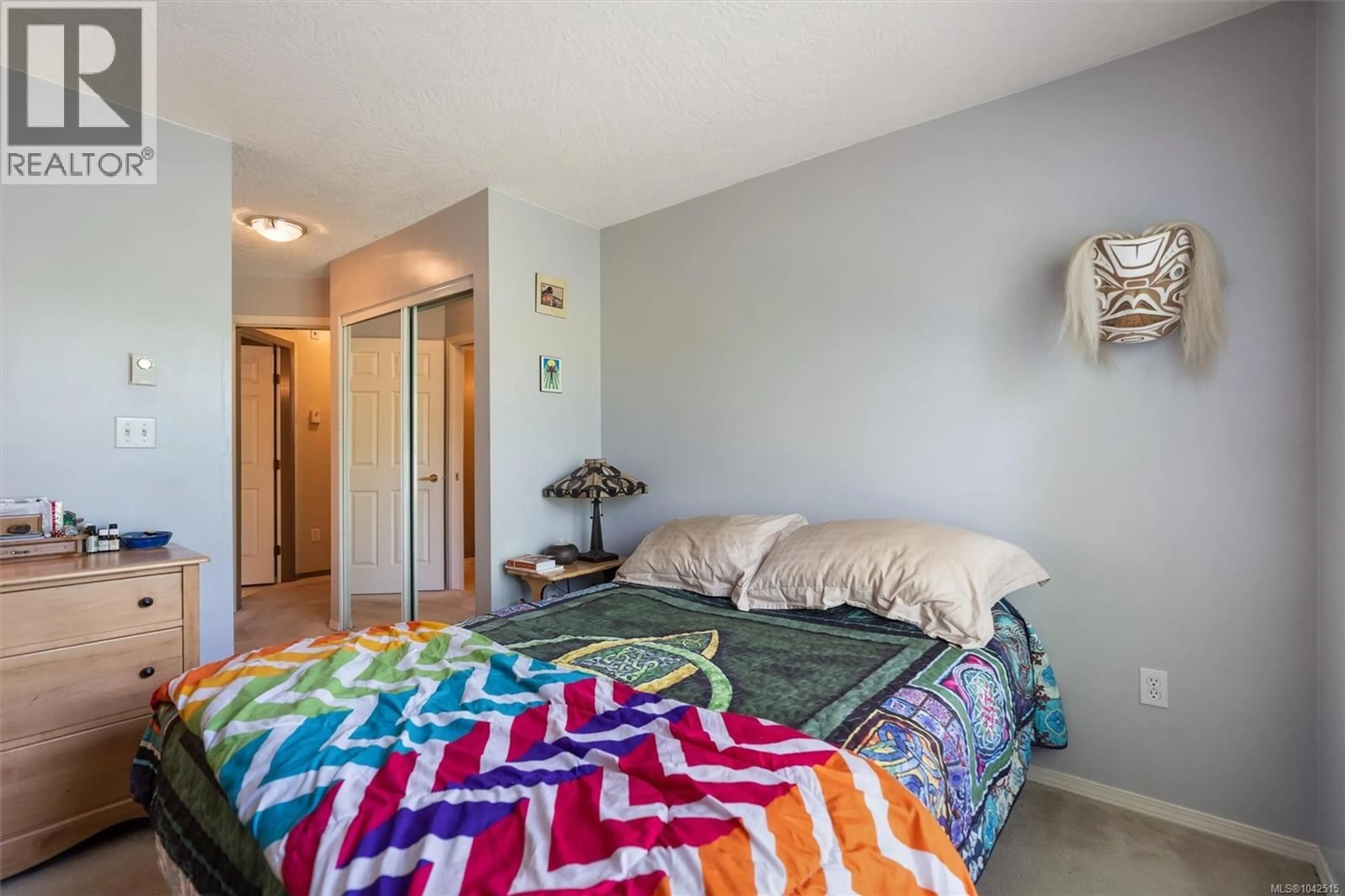 Bedroom with bed, carpet floor for 204 - 1055 HILLSIDE AVENUE, Victoria British Columbia V8T2A4