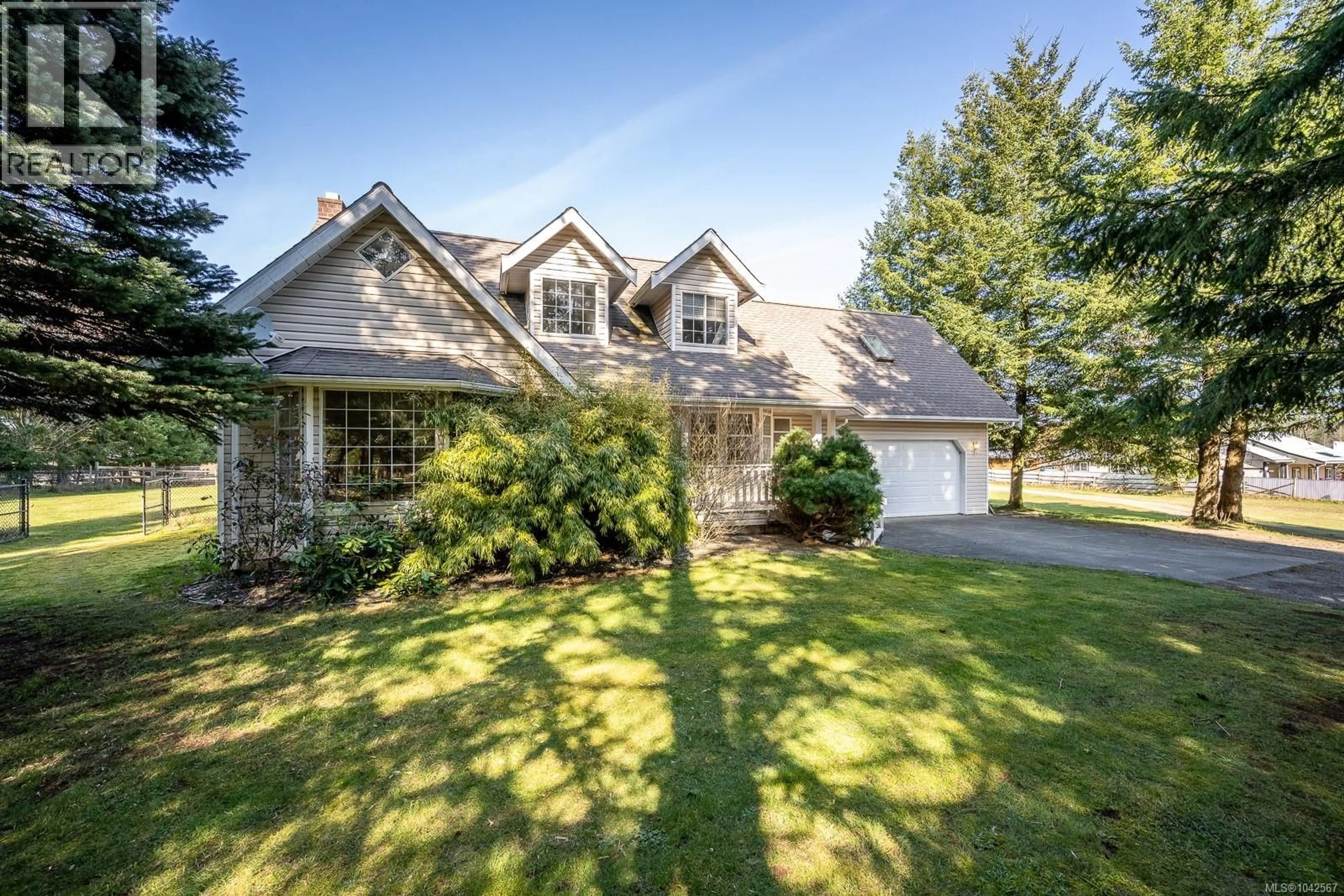 Home with vinyl exterior material, street for 6104 LEDINGHAM ROAD, Courtenay British Columbia V9J1M9