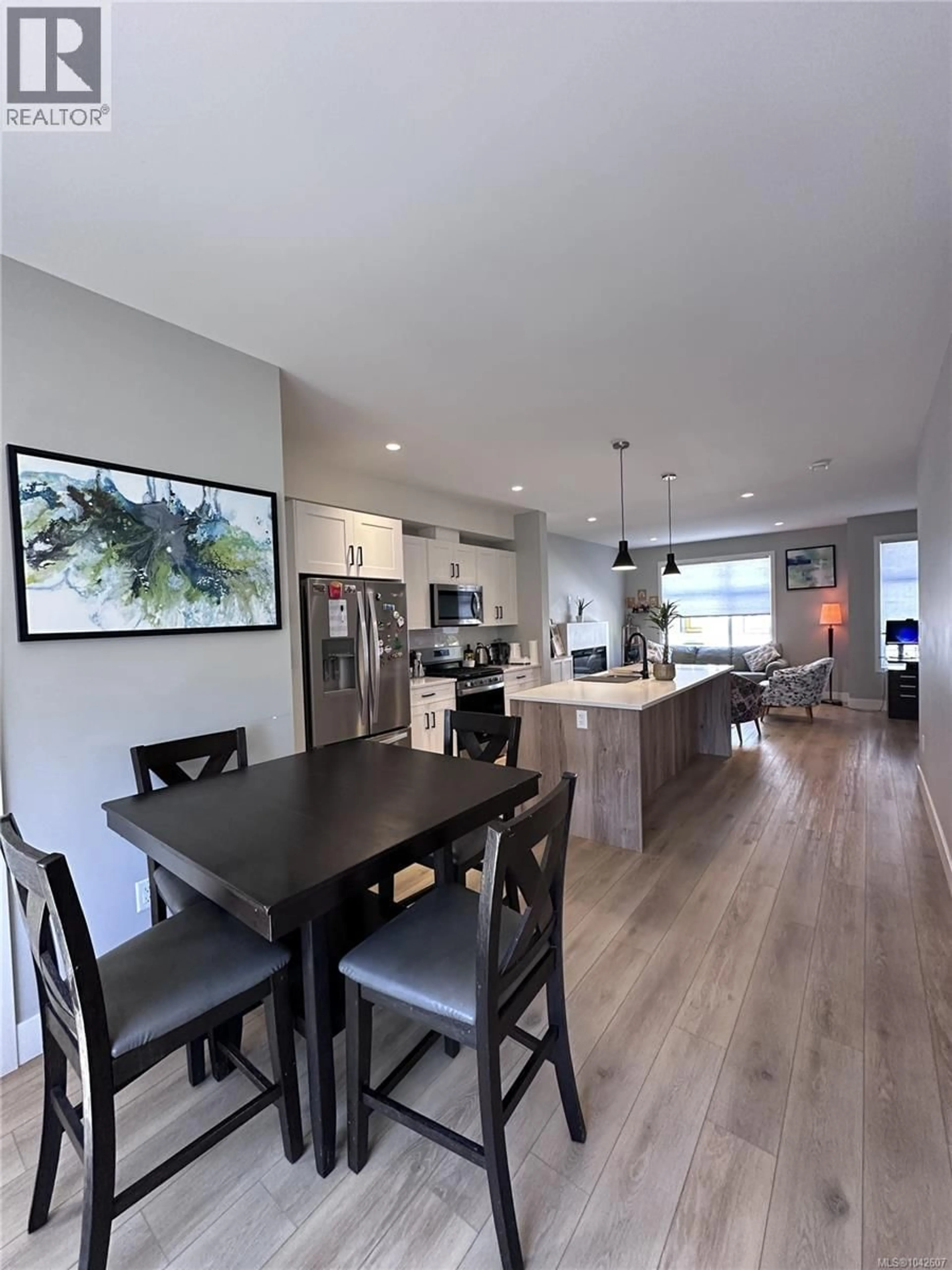 Open concept kitchen, wood/laminate floor for 110 - 2120 TRIANGLE TRAIL, Langford British Columbia V9C0R2