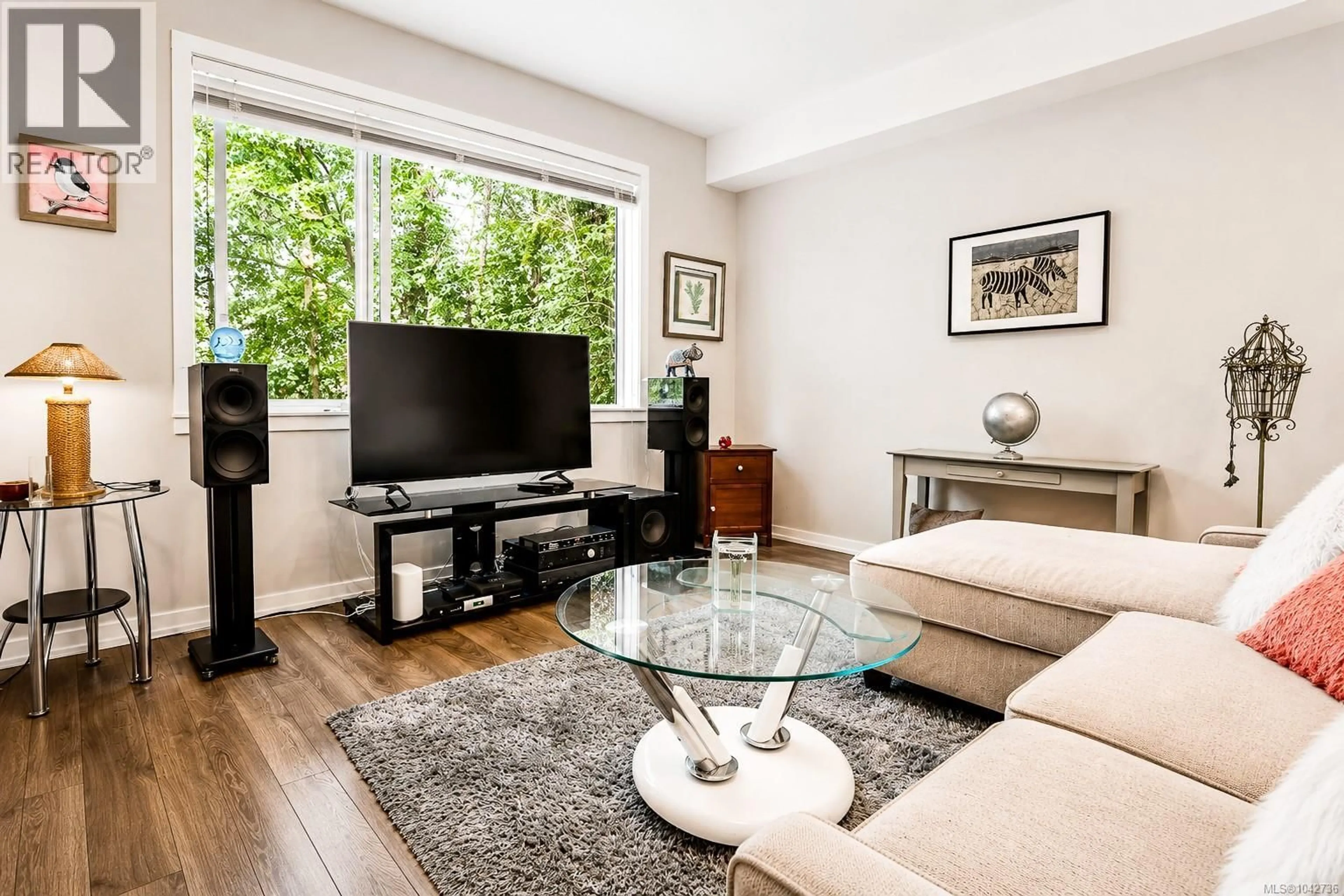 Living room with furniture, wood/laminate floor for 112 - 694 HOYLAKE AVENUE, Langford British Columbia V9B3P7