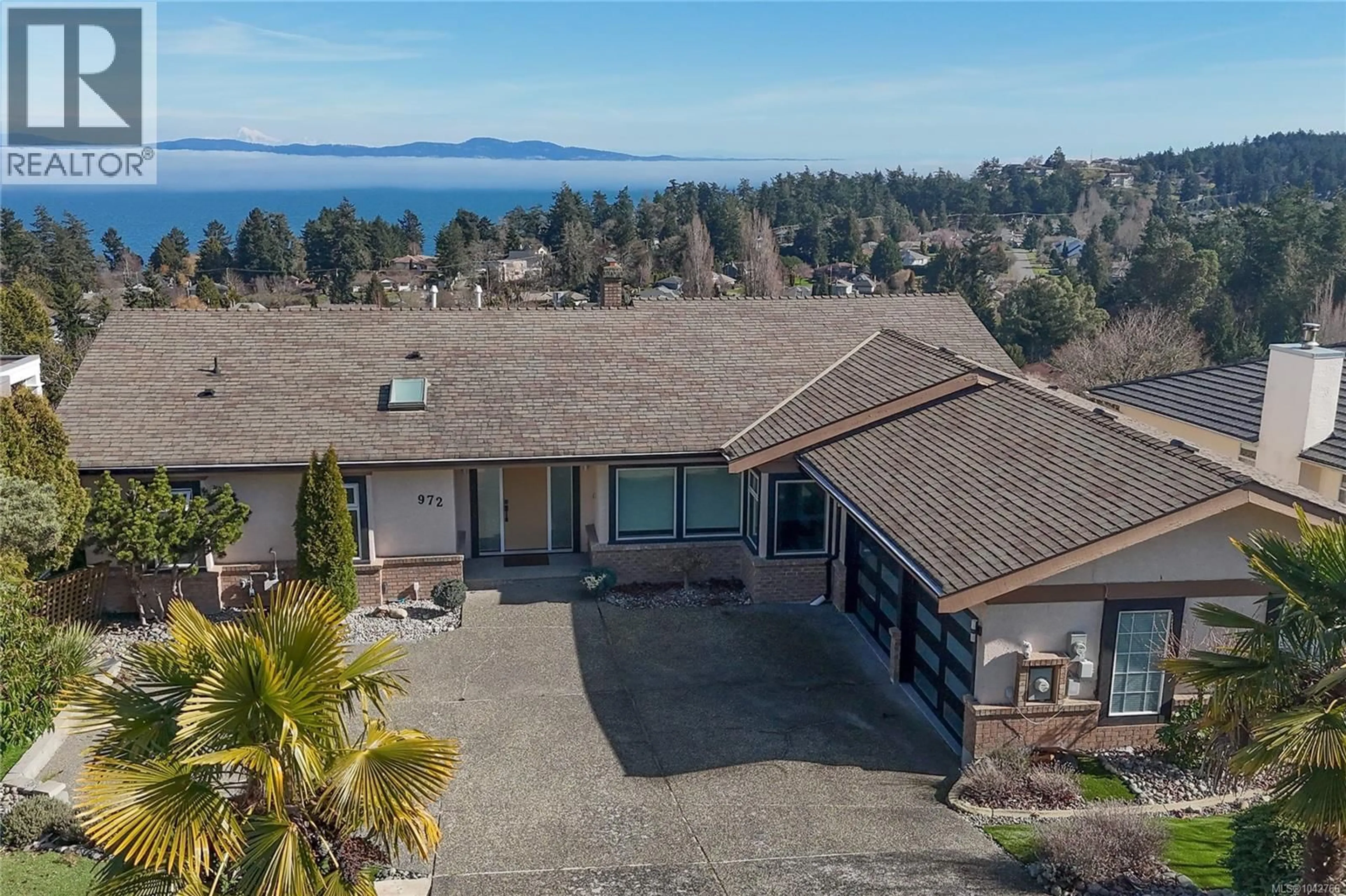 A pic from outside/outdoor area/front of a property/back of a property/a pic from drone, water/lake/river/ocean view for 972 SEAPEARL PLACE, Saanich British Columbia V8Y2X2