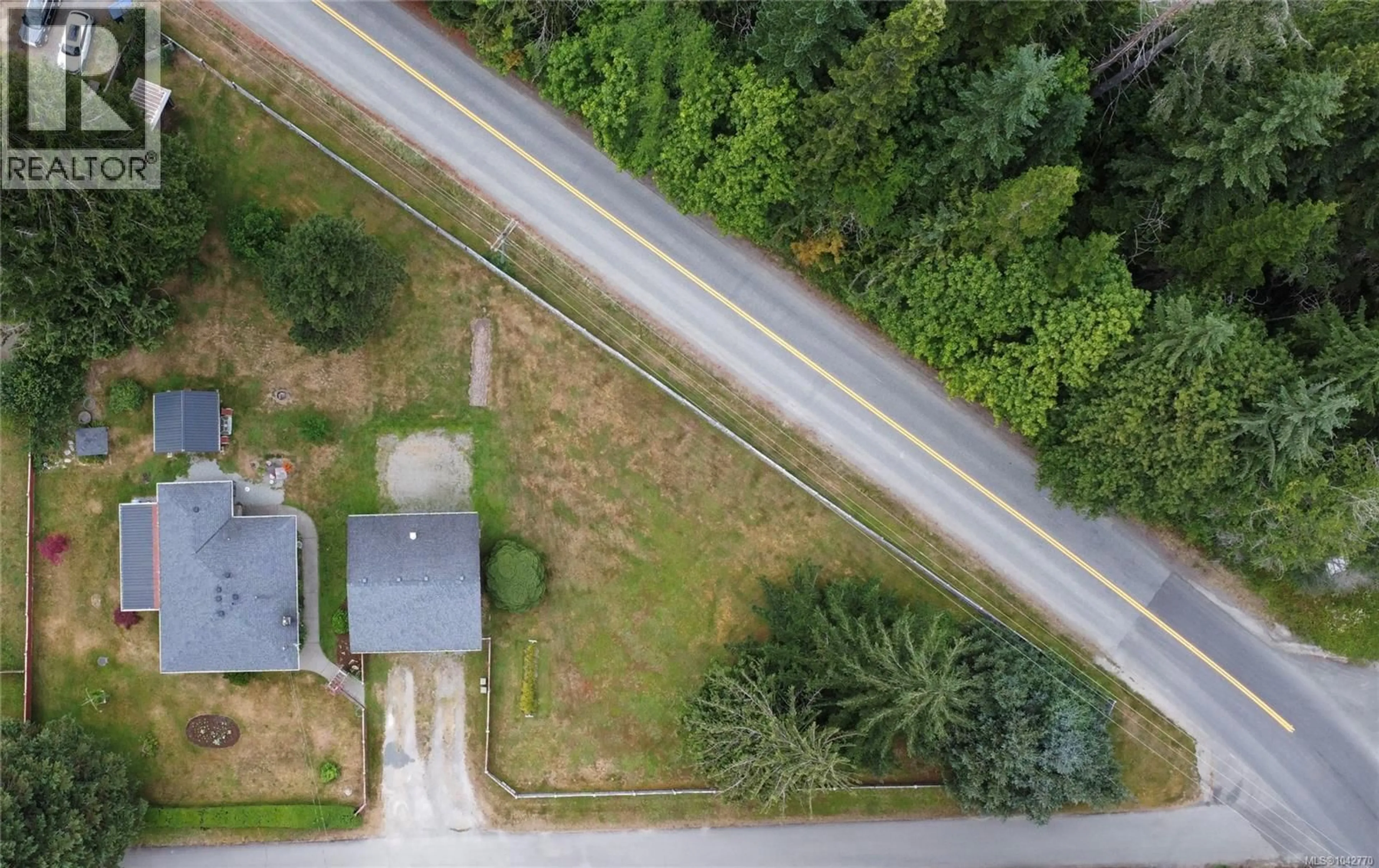 A pic from outside/outdoor area/front of a property/back of a property/a pic from drone, street for 10289 TAMEA ROAD, Honeymoon Bay British Columbia V0R1Y0