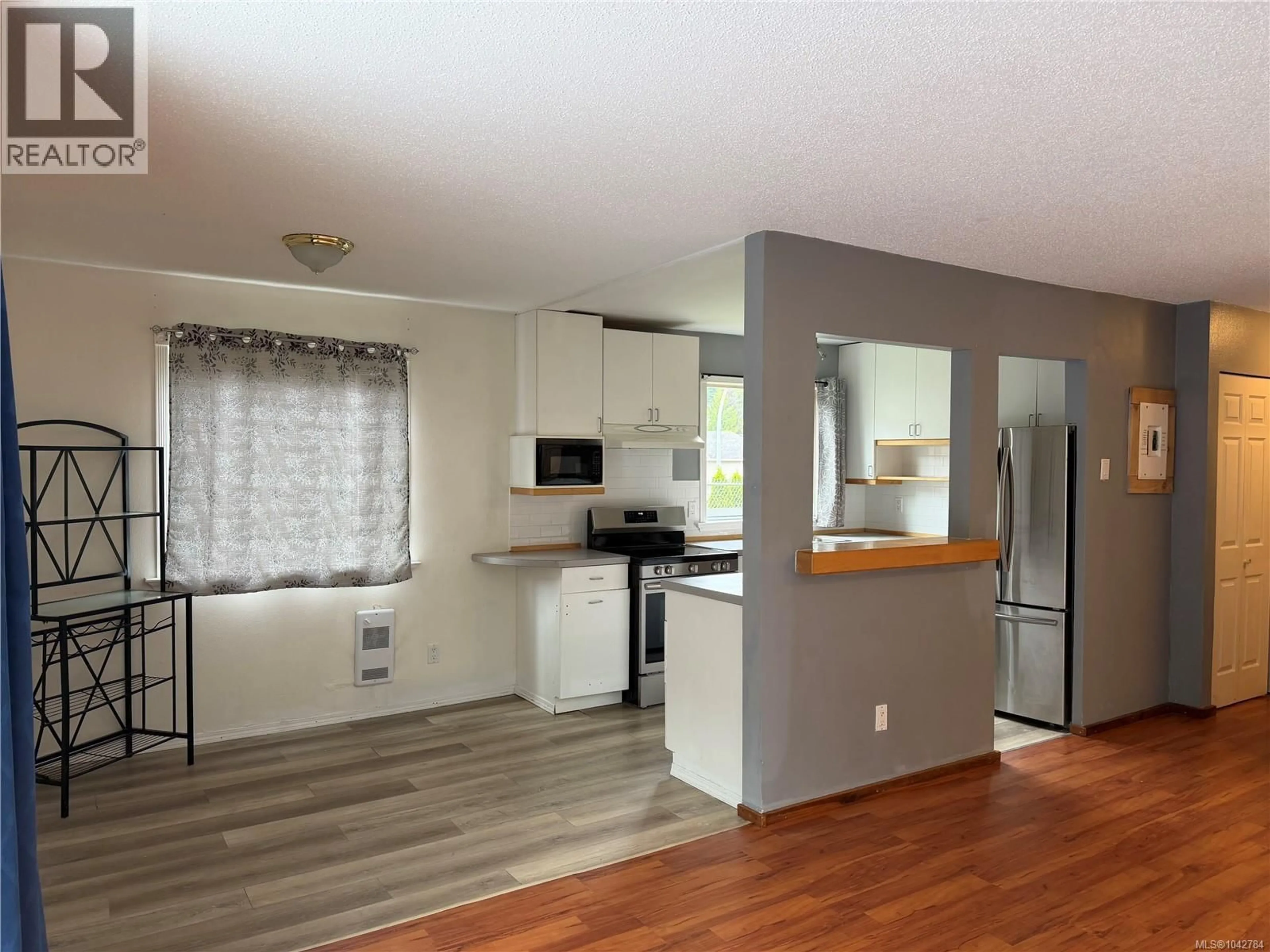 Open concept kitchen, wood/laminate floor for 44 - 7077 HIGHLAND DRIVE, Port Hardy British Columbia V0N2P0