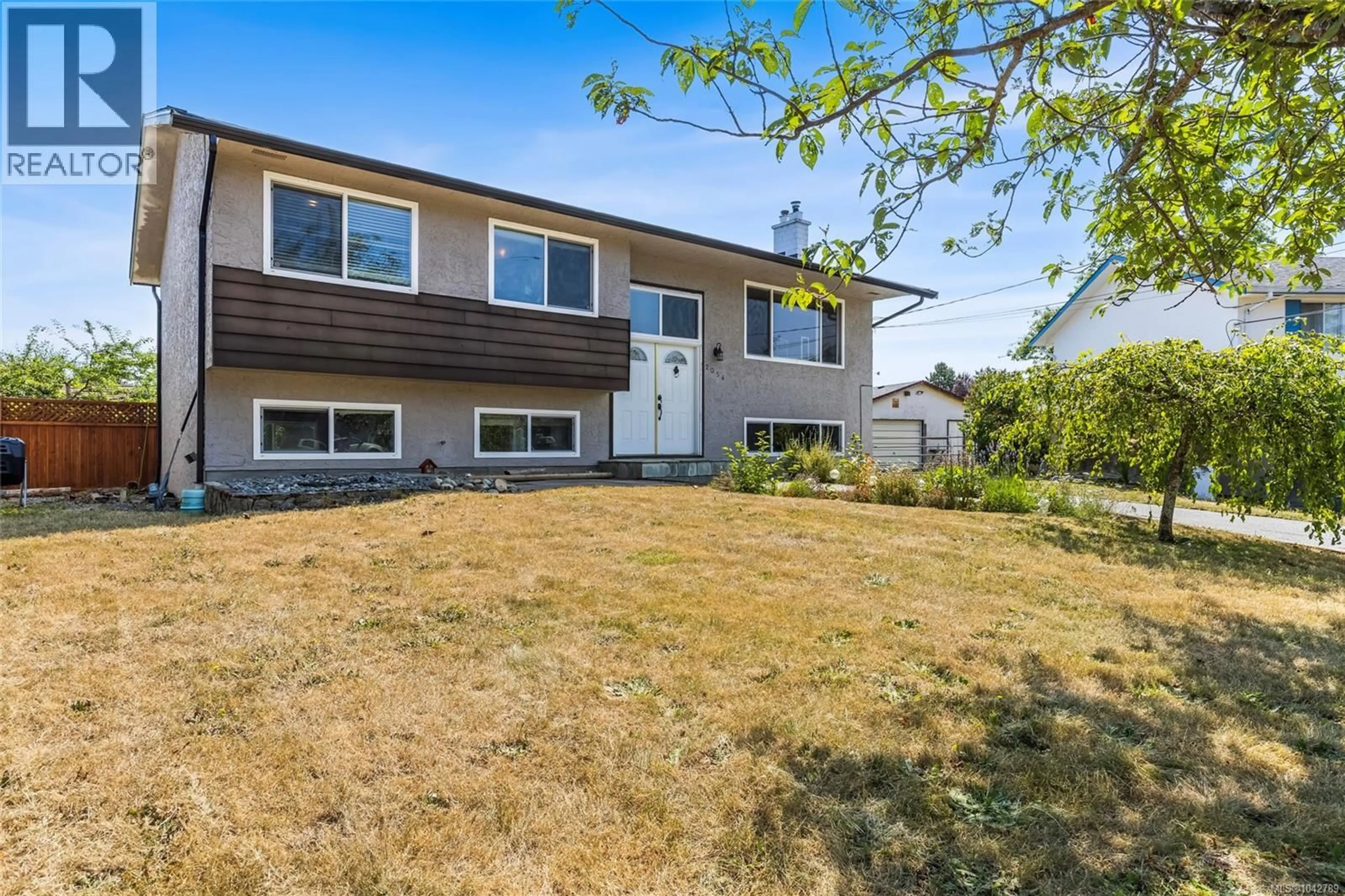 Home with vinyl exterior material, street for 2054 PIERCY AVENUE, Sidney British Columbia V8L2K5