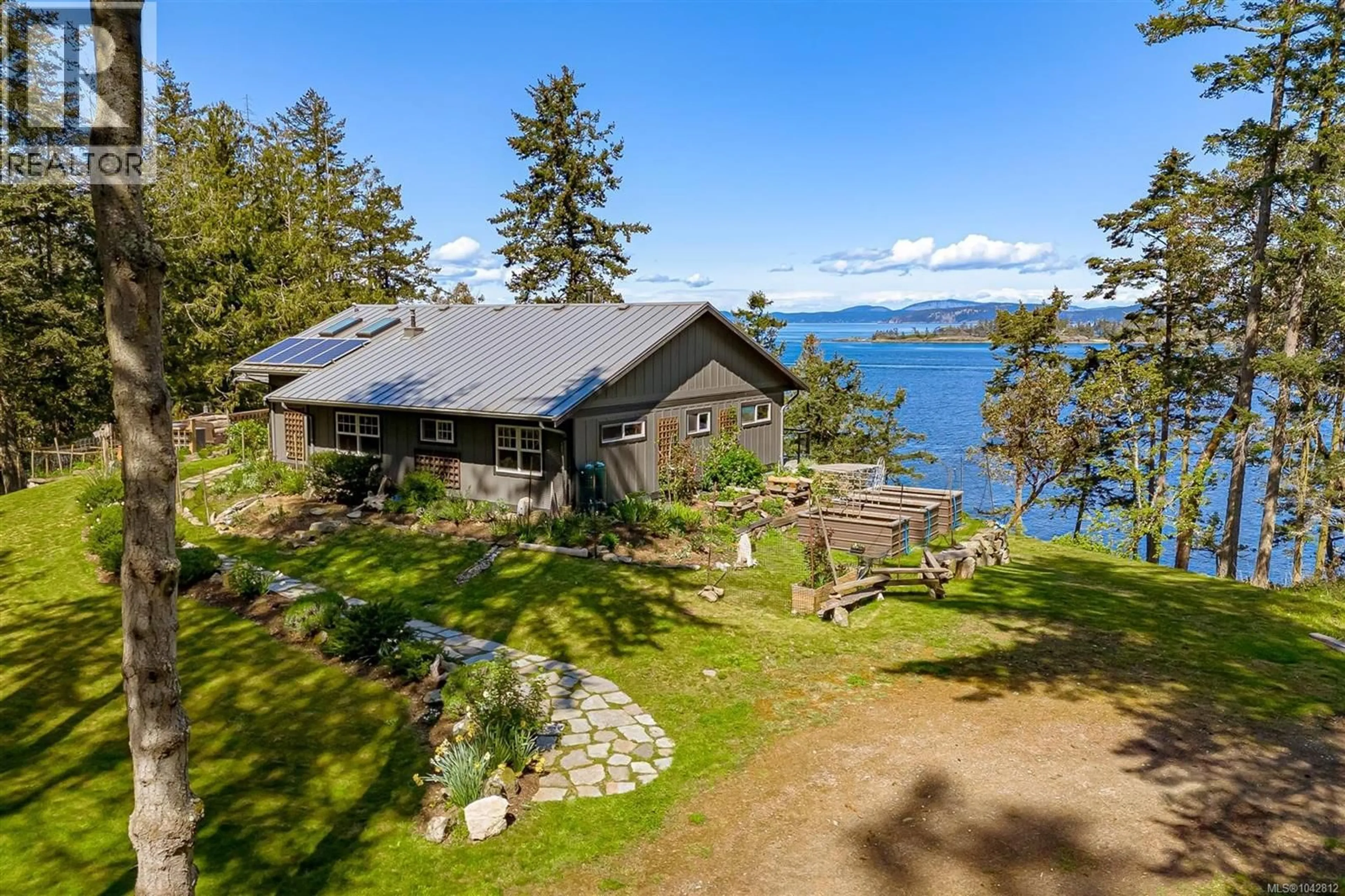 A pic from outside/outdoor area/front of a property/back of a property/a pic from drone, water/lake/river/ocean view for 1308 GREENLEAF LANE, Sidney Island British Columbia V0N2G0