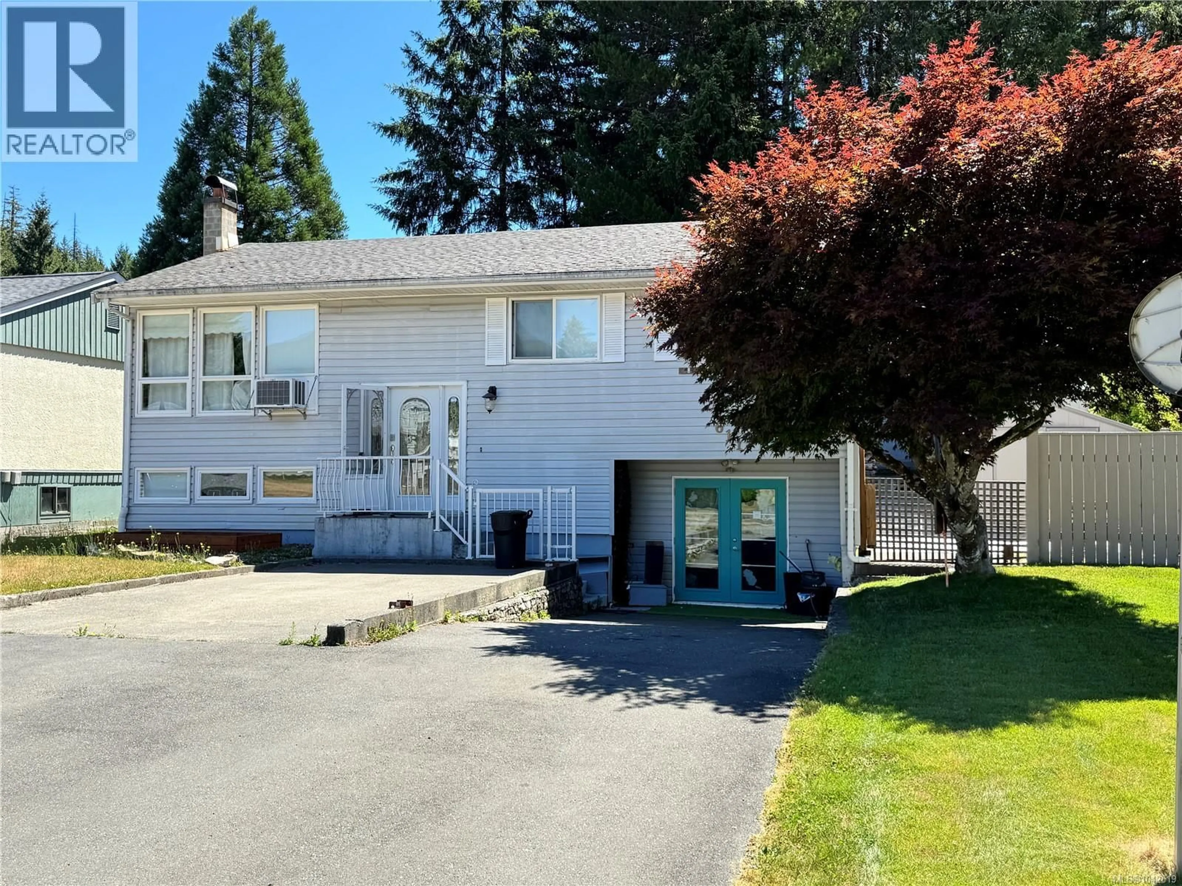 Home with vinyl exterior material, street for 611 NIMPKISH DRIVE, Gold River British Columbia V0P1G0