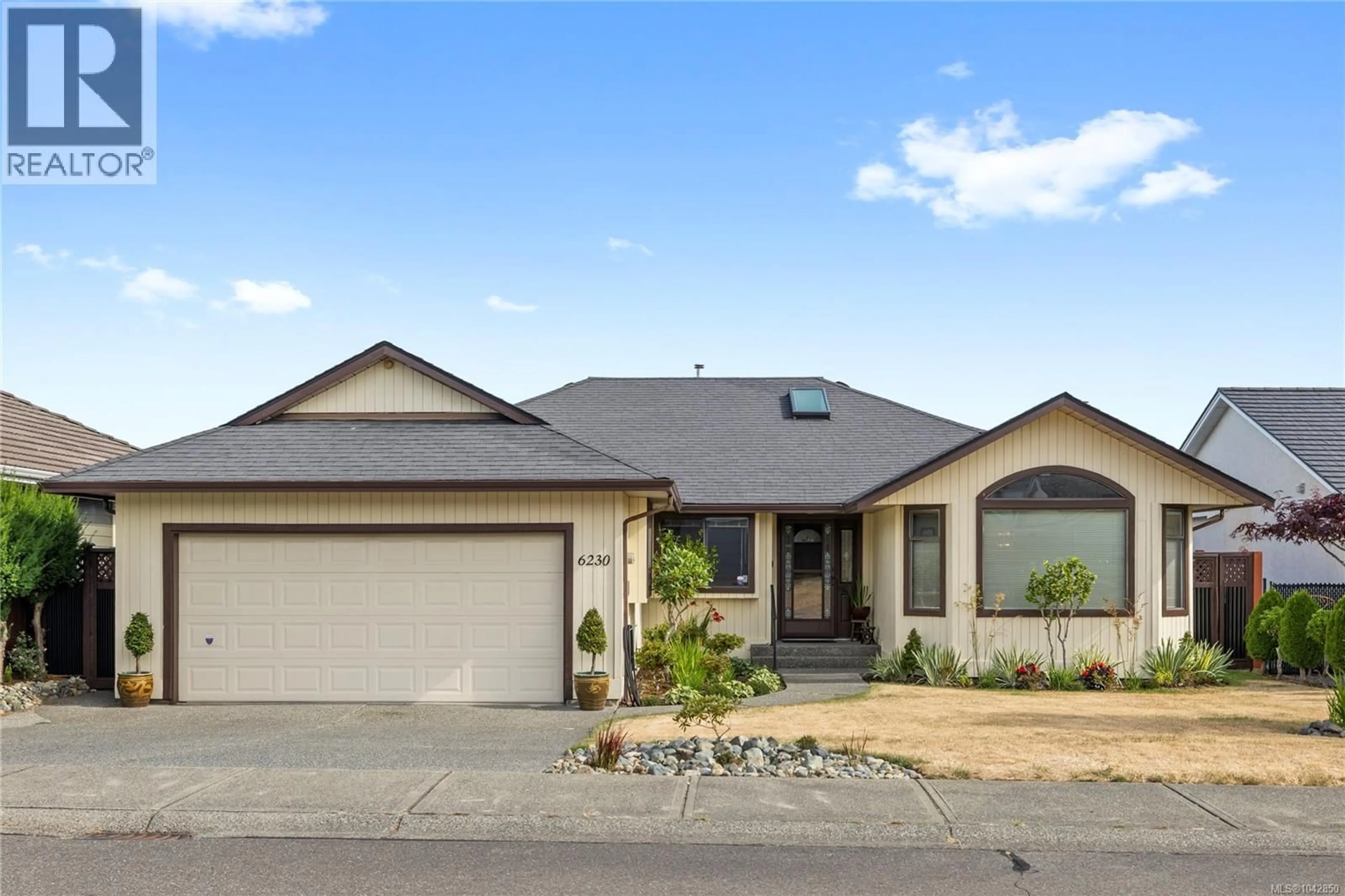 Home with vinyl exterior material, street for 6230 WATERBURY ROAD, Nanaimo British Columbia V9V1L5