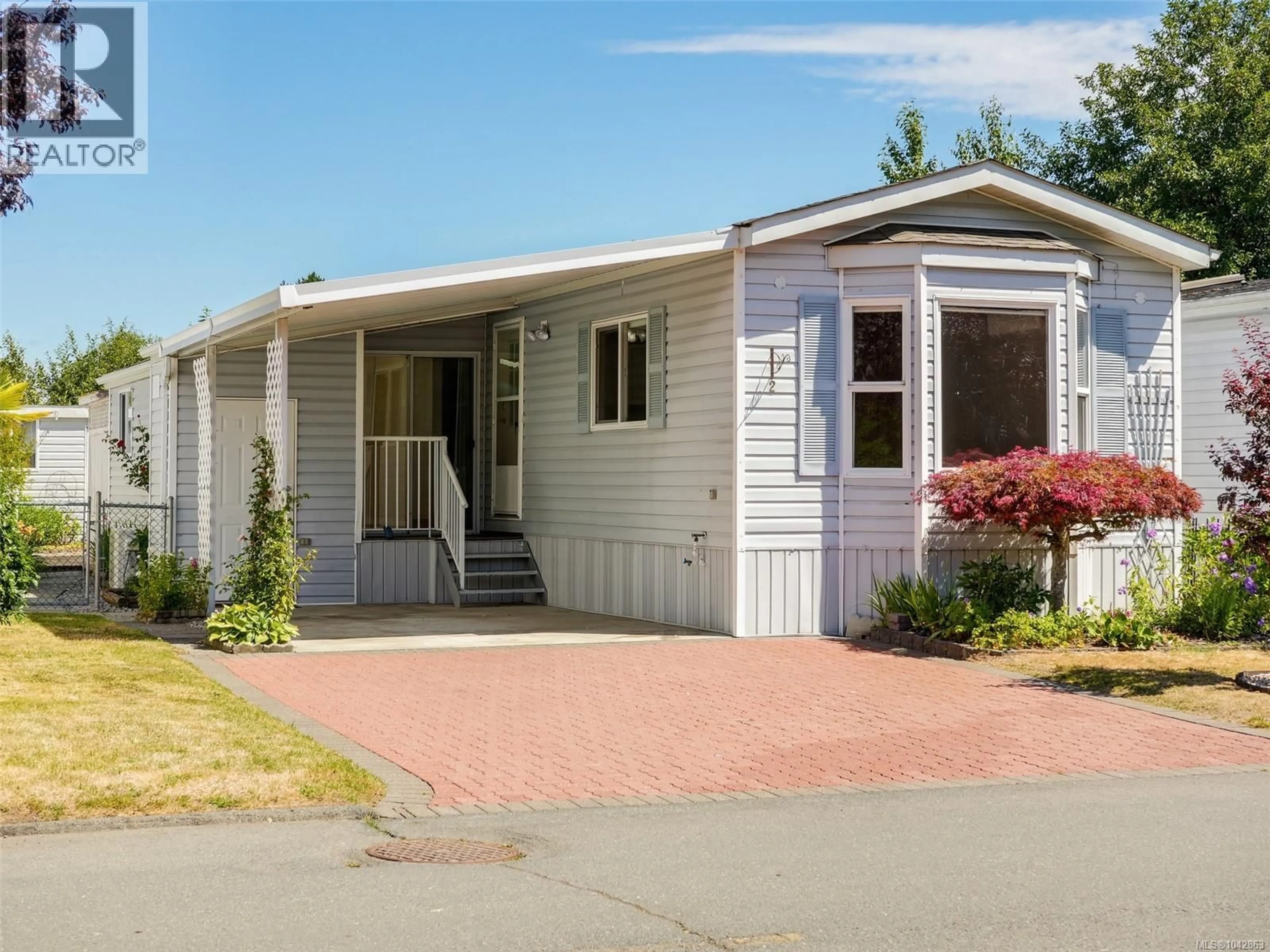 Home with vinyl exterior material, street for 2 - 7509 CENTRAL SAANICH ROAD, Central Saanich British Columbia V8M2B5
