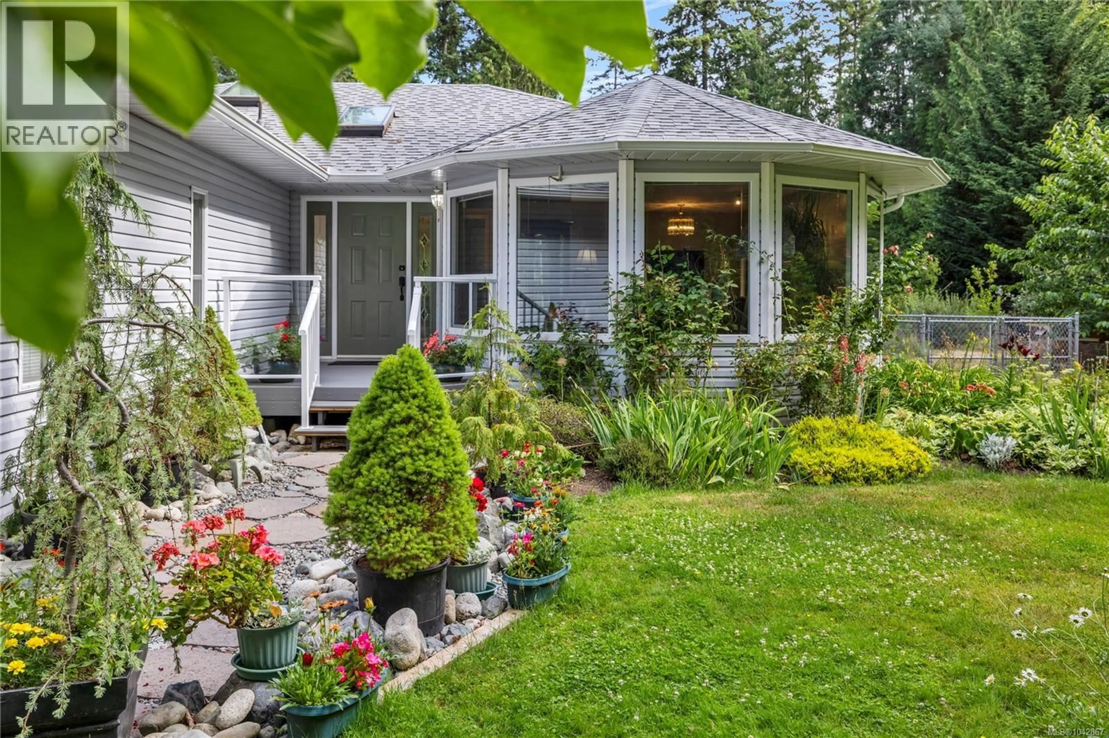 Home with vinyl exterior material, street for 3198 MELON ROAD, Hilliers British Columbia V9K2J5