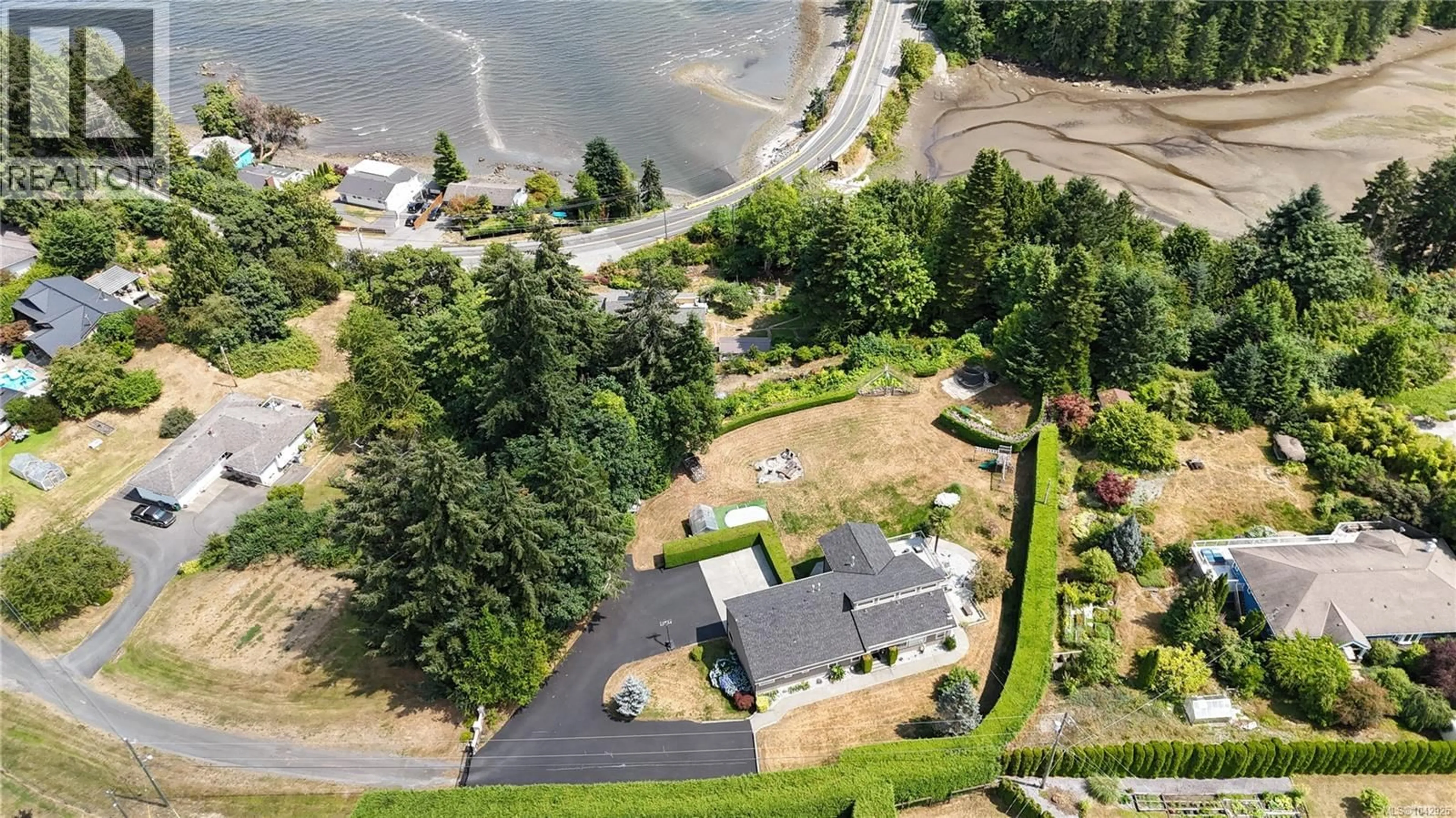 A pic from outside/outdoor area/front of a property/back of a property/a pic from drone, water/lake/river/ocean view for 11127 BRANKSOME ROAD, Saltair British Columbia V9G1Y8