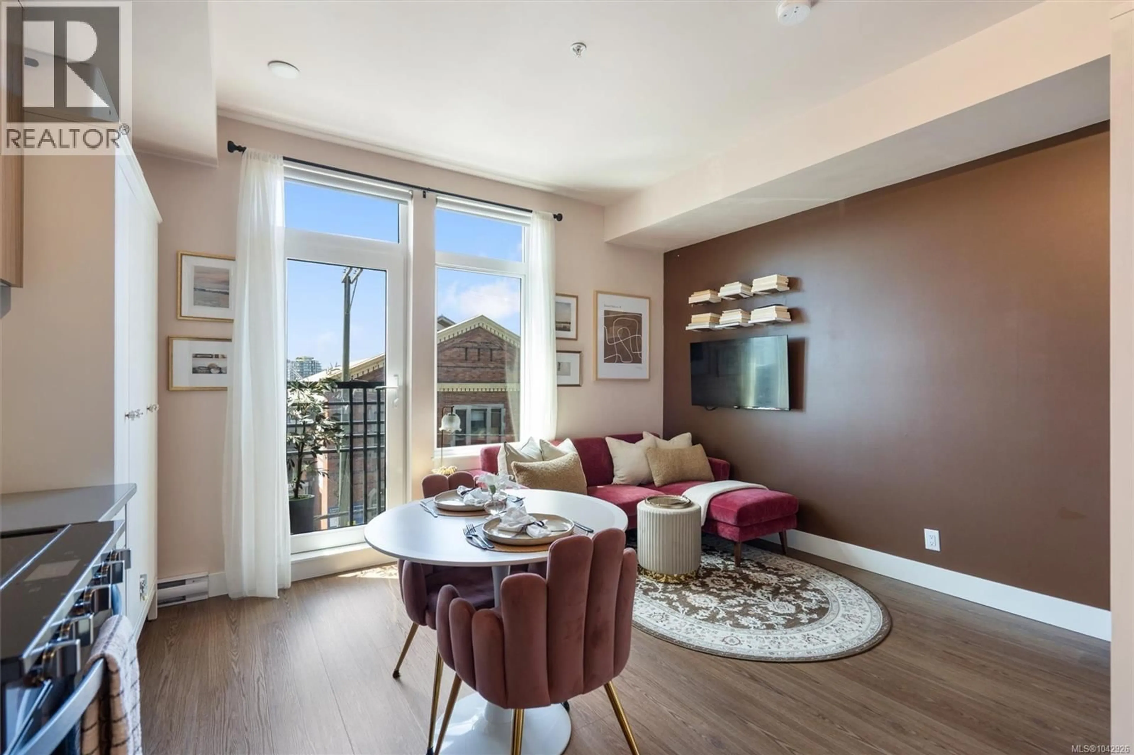 Living room with furniture, wood/laminate floor for 310 - 515 CHATHAM STREET, Victoria British Columbia V8T0C8
