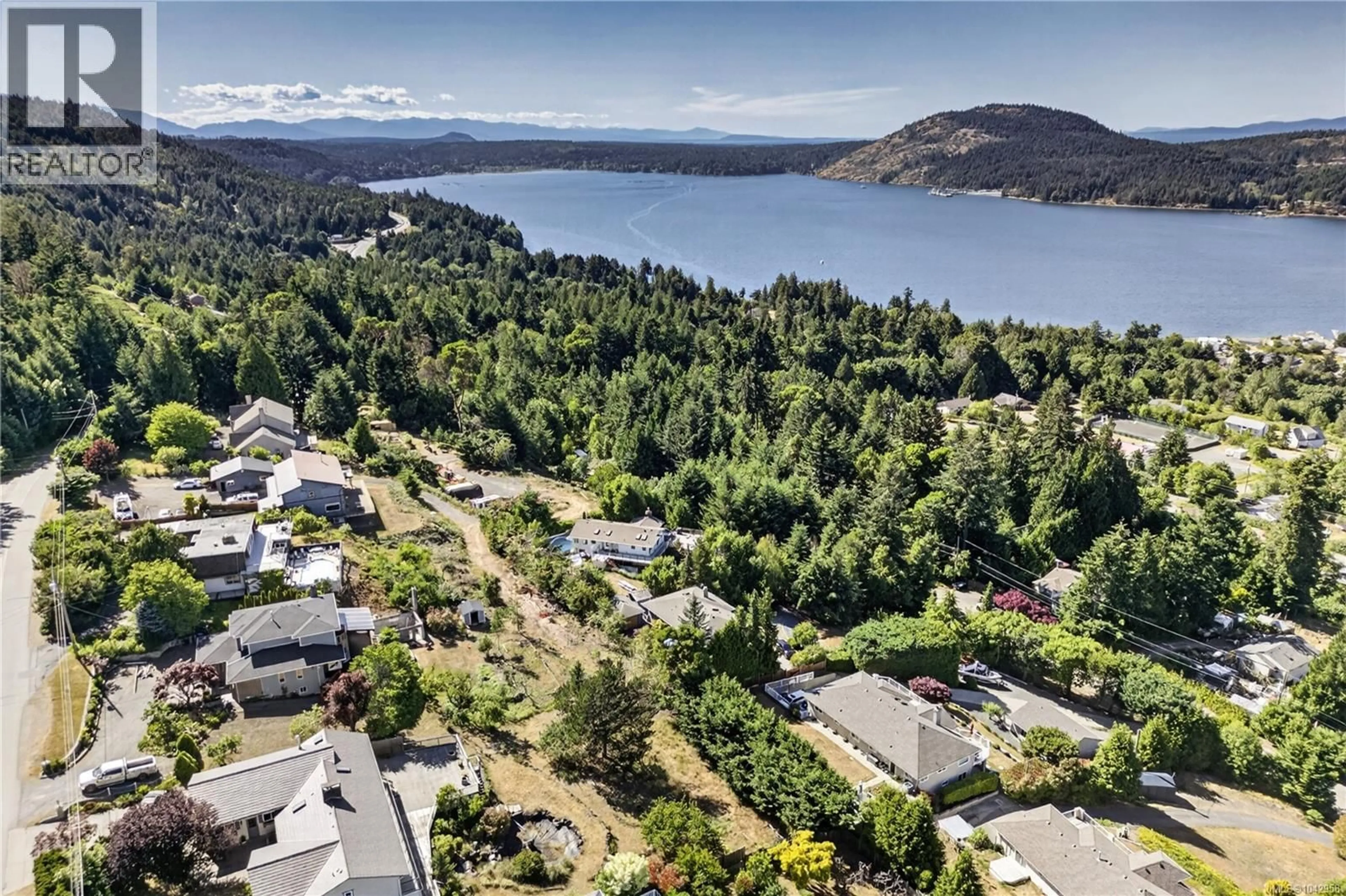 A pic from outside/outdoor area/front of a property/back of a property/a pic from drone, water/lake/river/ocean view for 8109 NORTHWIND DRIVE, Lantzville British Columbia V0R2H0