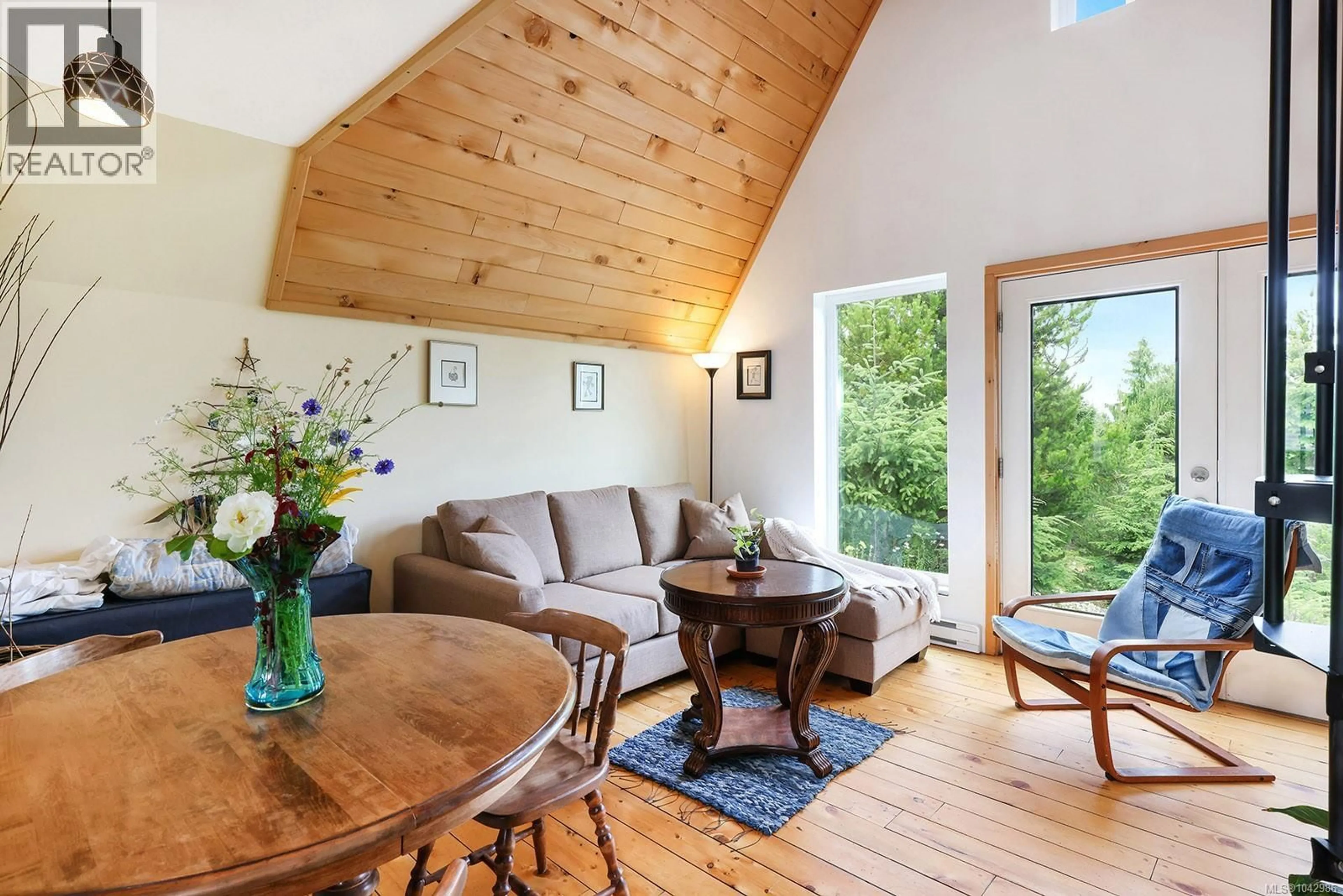 Living room with furniture, wood/laminate floor for 4150 PINECREST ROAD, Denman Island British Columbia V0R1T0