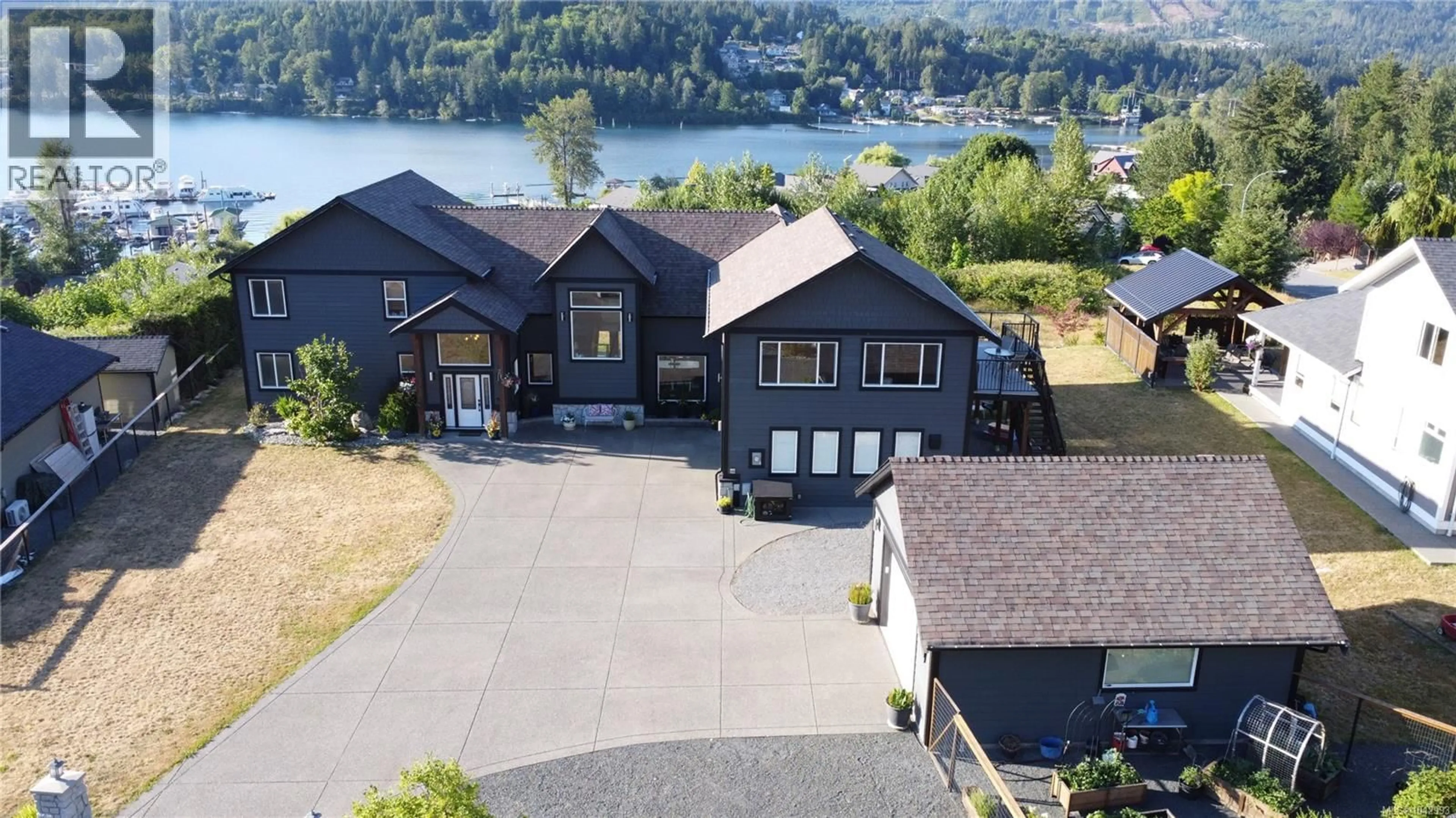 A pic from outside/outdoor area/front of a property/back of a property/a pic from drone, water/lake/river/ocean view for 213 TAL CRESCENT, Lake Cowichan British Columbia V0R2G0