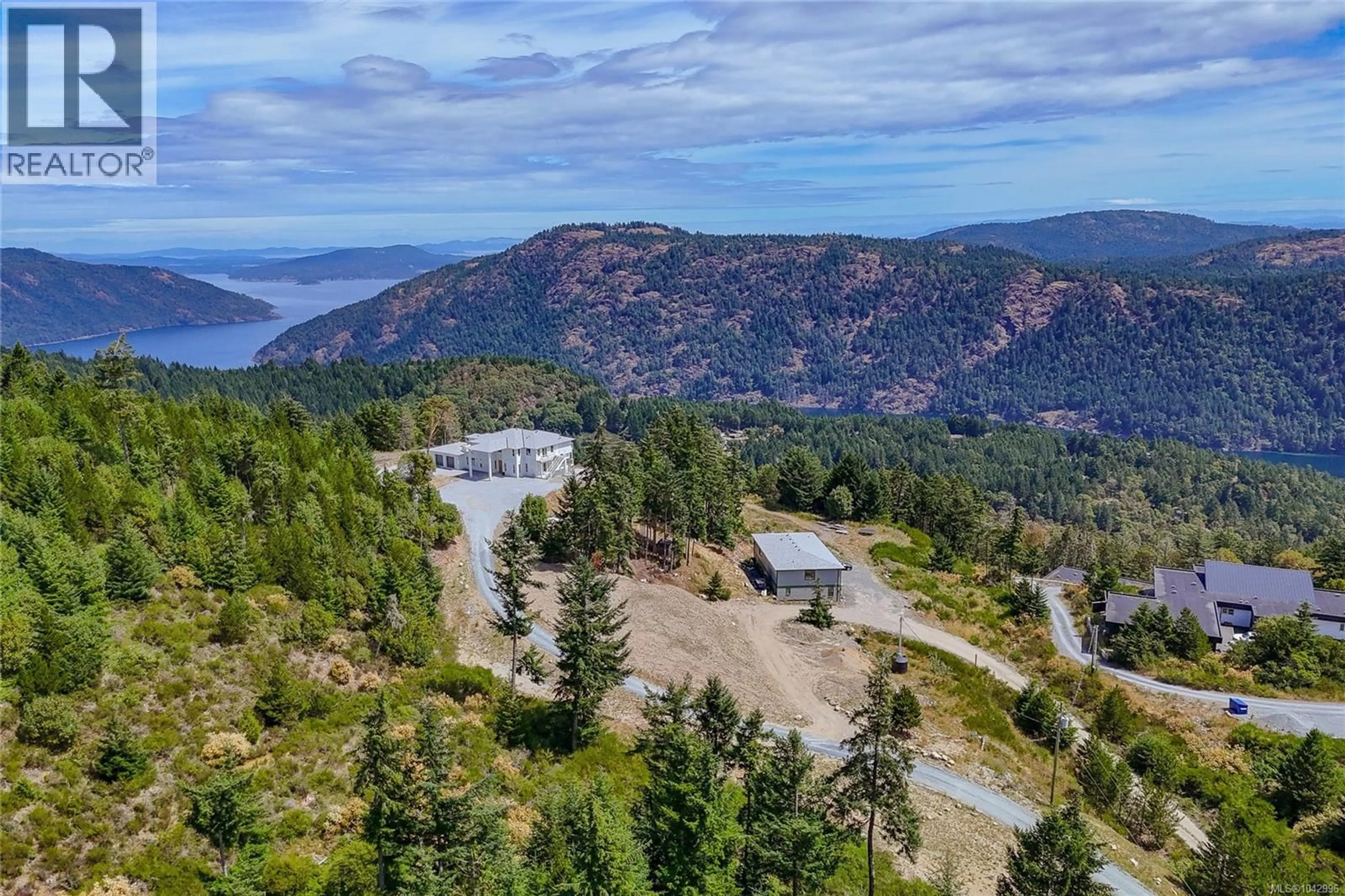 A pic from outside/outdoor area/front of a property/back of a property/a pic from drone, water/lake/river/ocean view for 3981 GOLDSTREAM HEIGHTS DRIVE, Shawnigan Lake British Columbia V0R2L0
